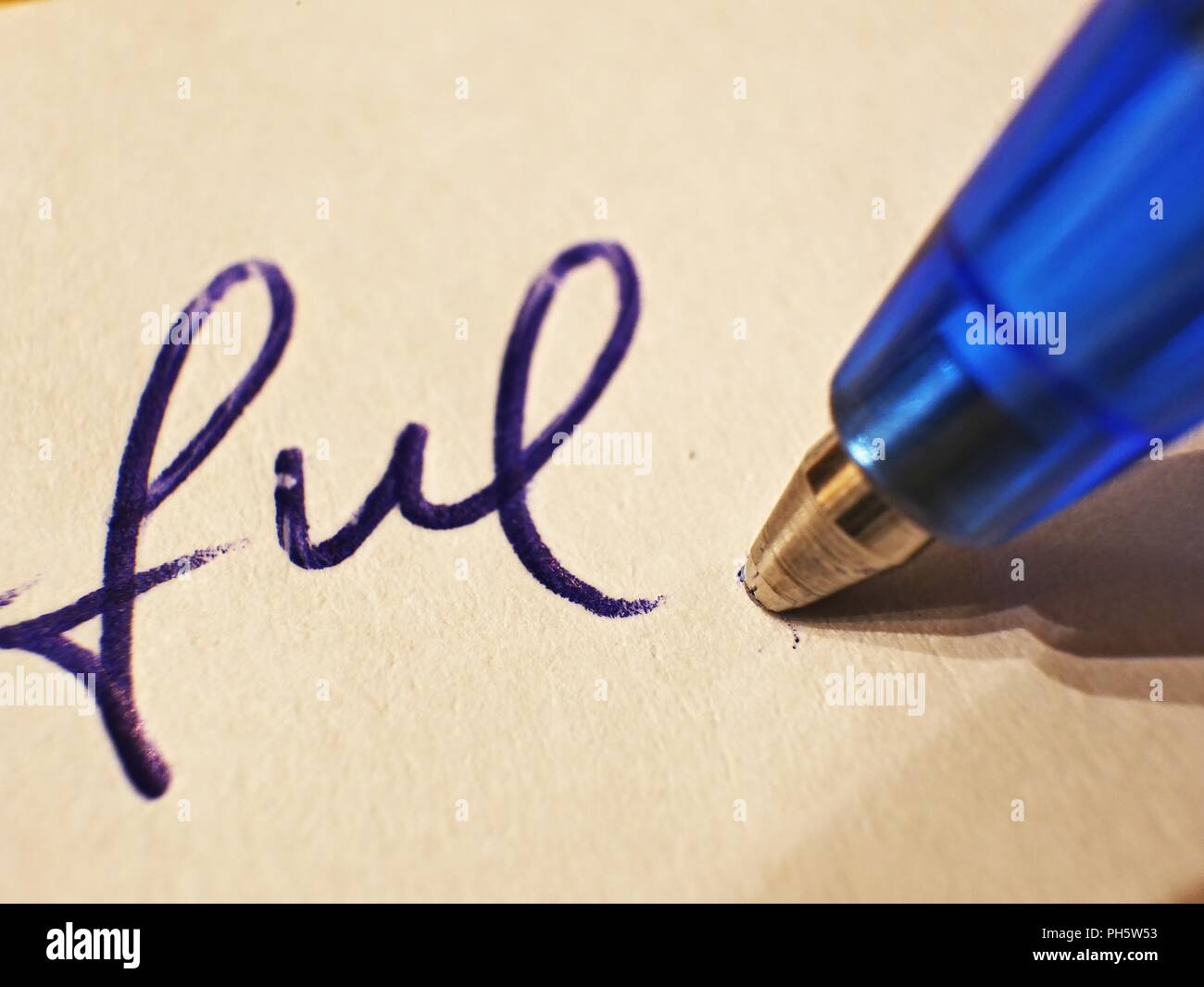 closeup of writing with blue ballpoint pen, blue ink on white paper Stock  Photo - Alamy