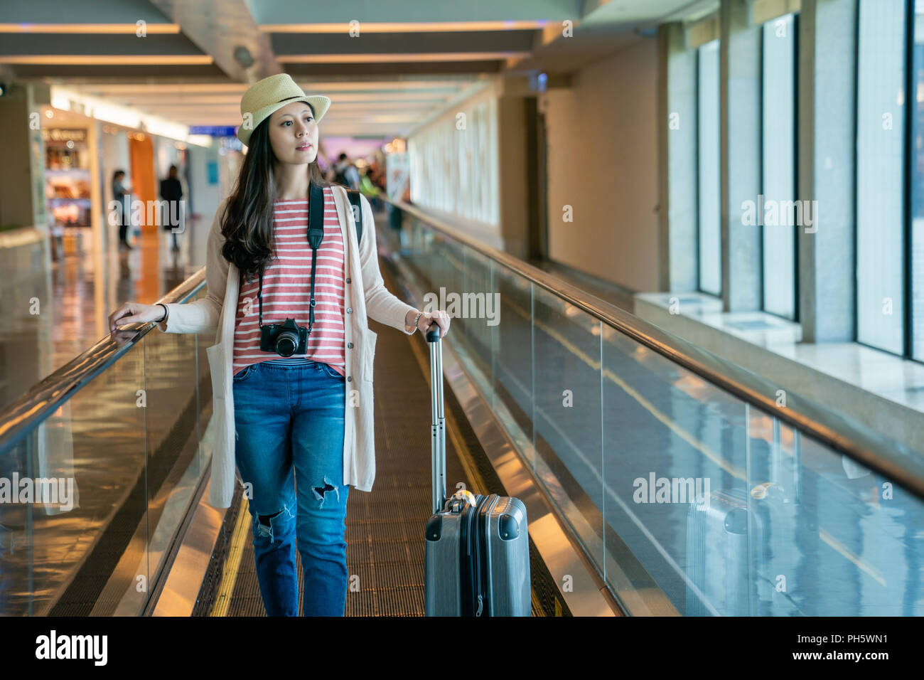 visitor standing on the movable conveyor belt. use floor escalator