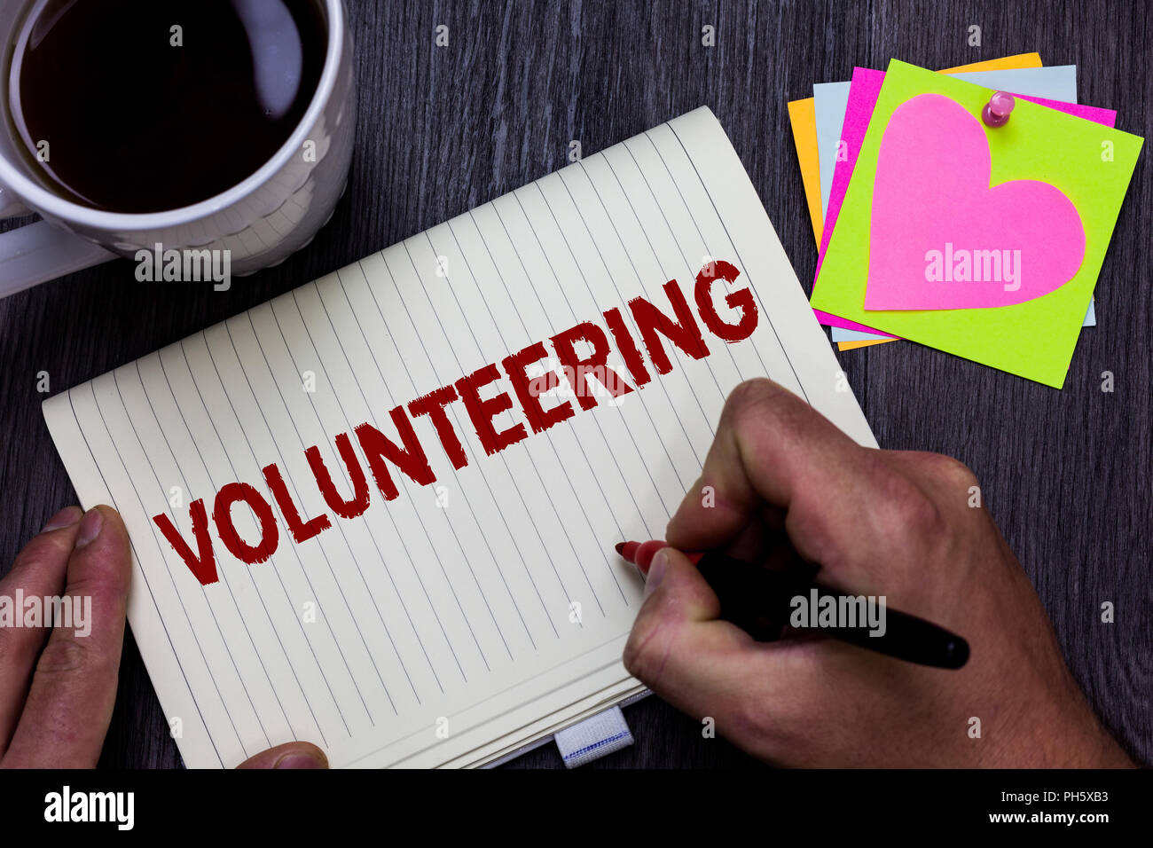 Conceptual hand writing showing Volunteering. Business photo text ...