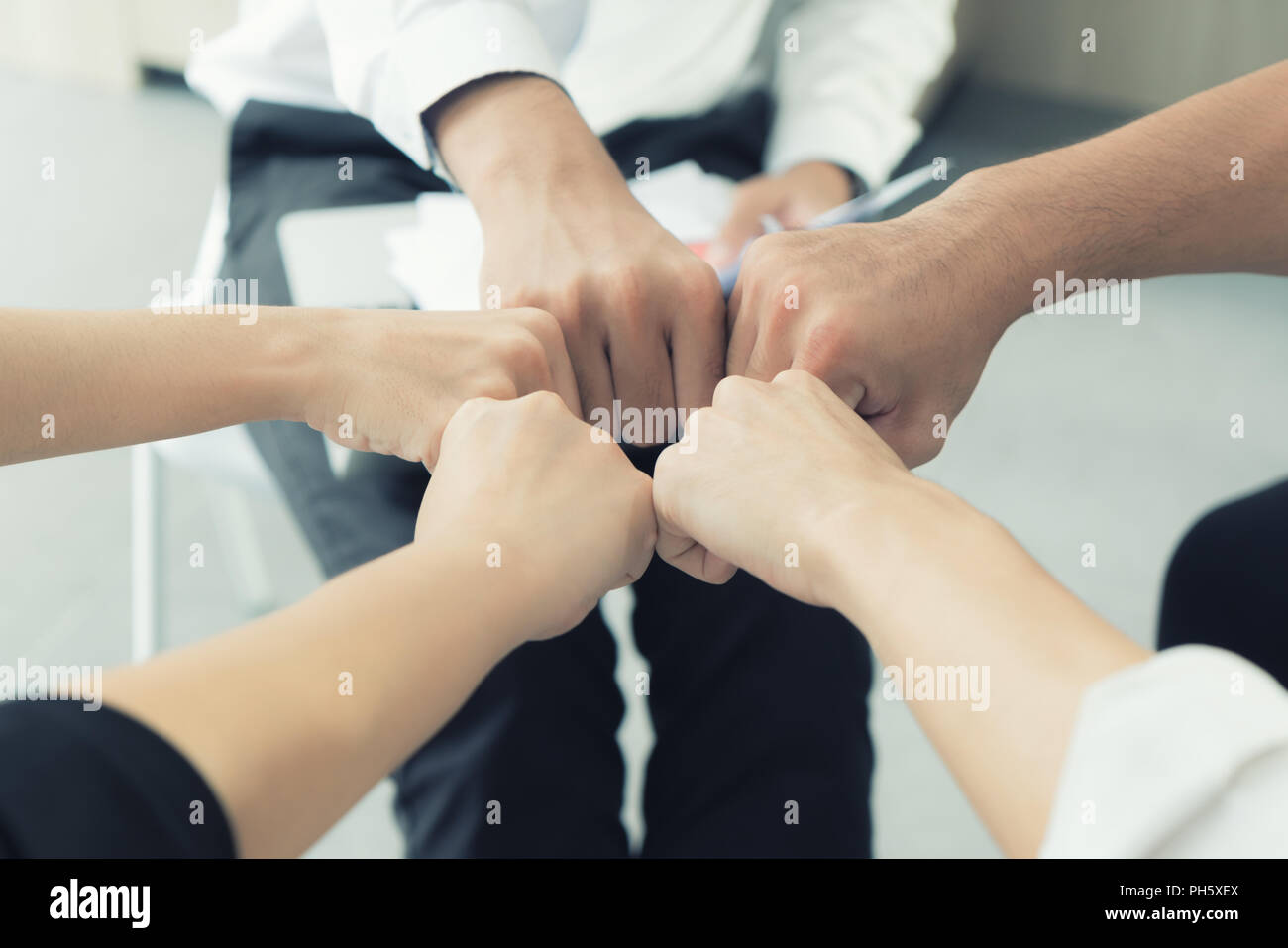 Hand partnership business team giving Fist Bump after complete deal business project Stock Photo