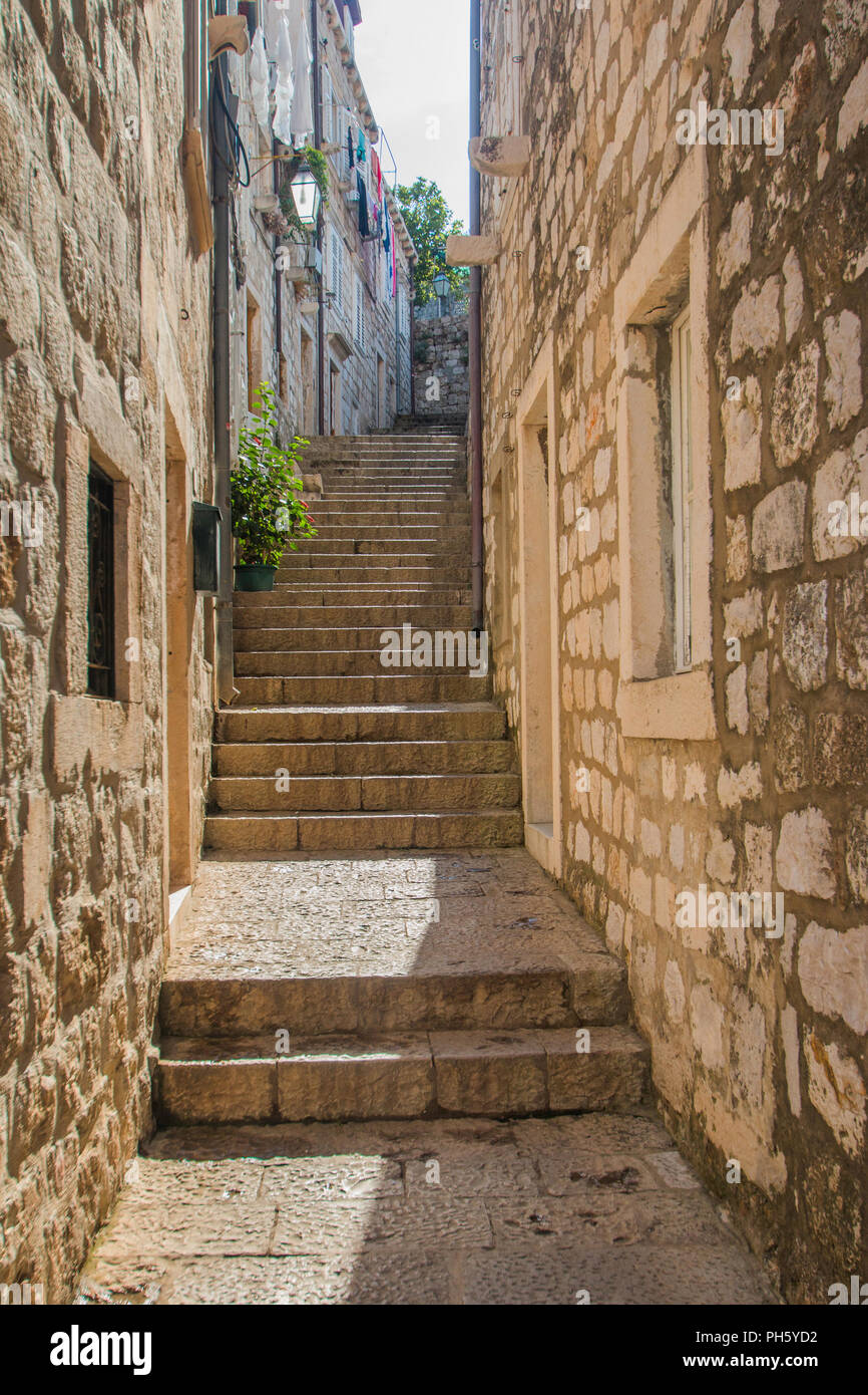 Narrow street and stairs in the Old Town in Dubrovnik, Croatia, Mediterranean ambient Stock Photo