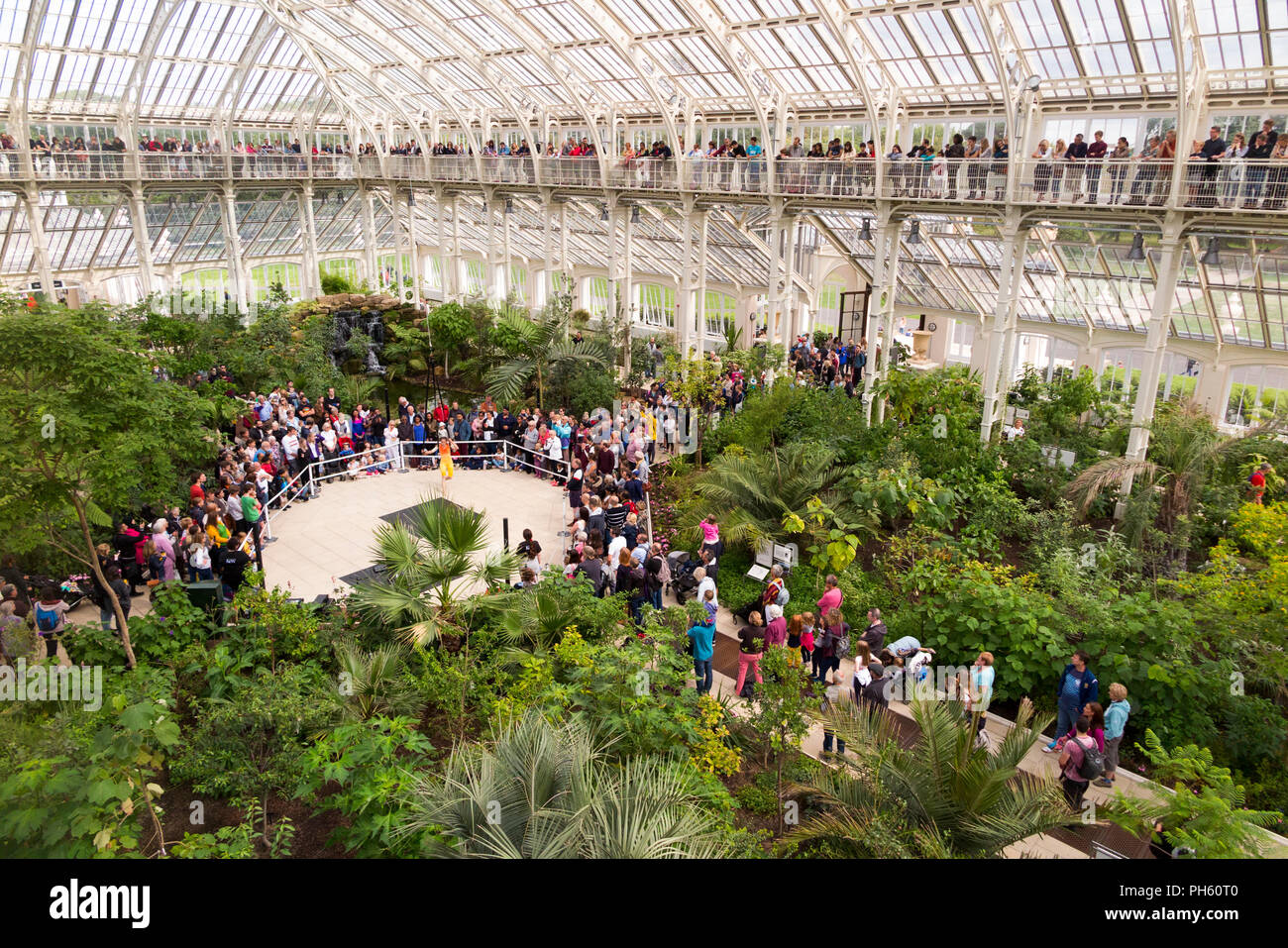 Acrobatic and musical performance / Harmonic by Cirque Bijou watched by visitor audience during holiday at Kew gardens / Royal botanic garden. London Stock Photo