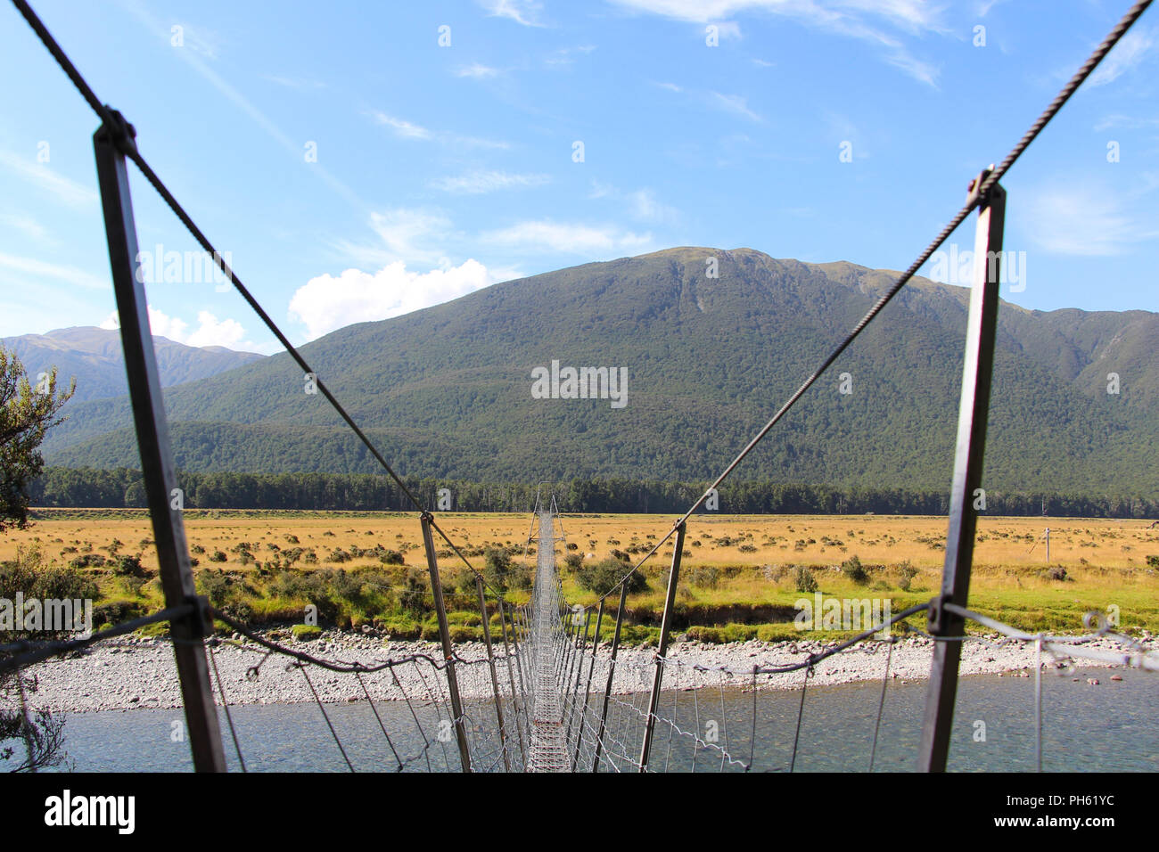 Very long suspension bridge over river in New Zealand Stock Photo Alamy