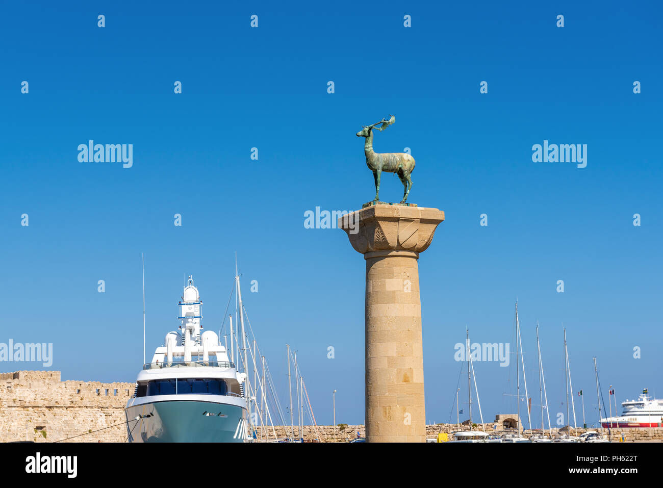 Bronze deer statue in Mandraki harbor of Rhodes town. Rhodes island