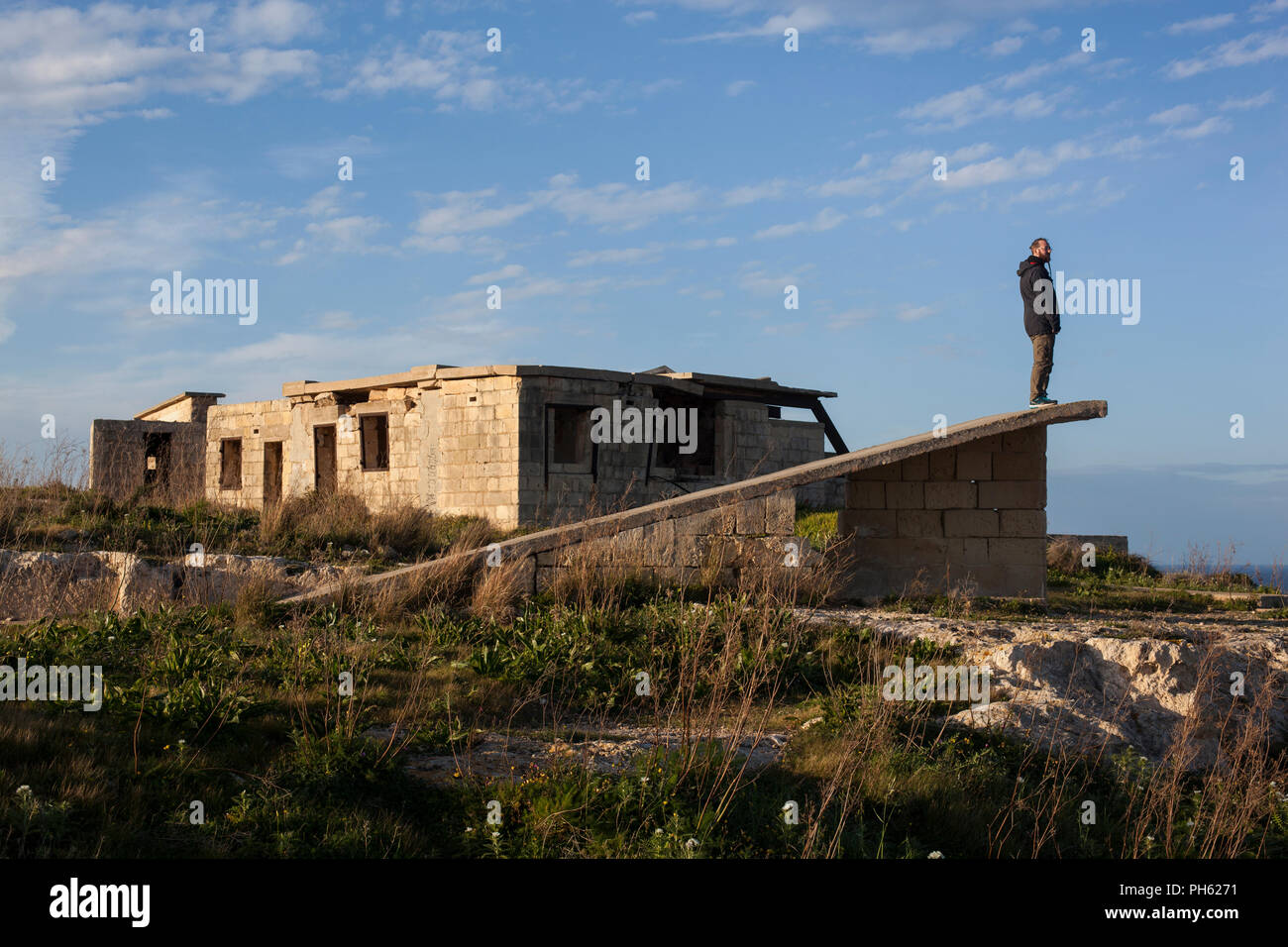 Man standing at the top of the wall at Fort Campbell on Malta Stock Photo