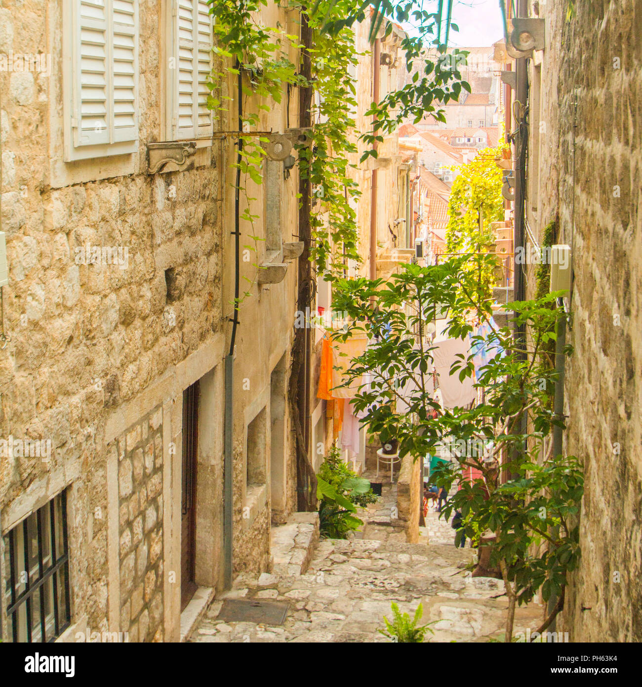 Narrow street and stairs in the Old Town in Dubrovnik, Croatia, Mediterranean ambient Stock Photo