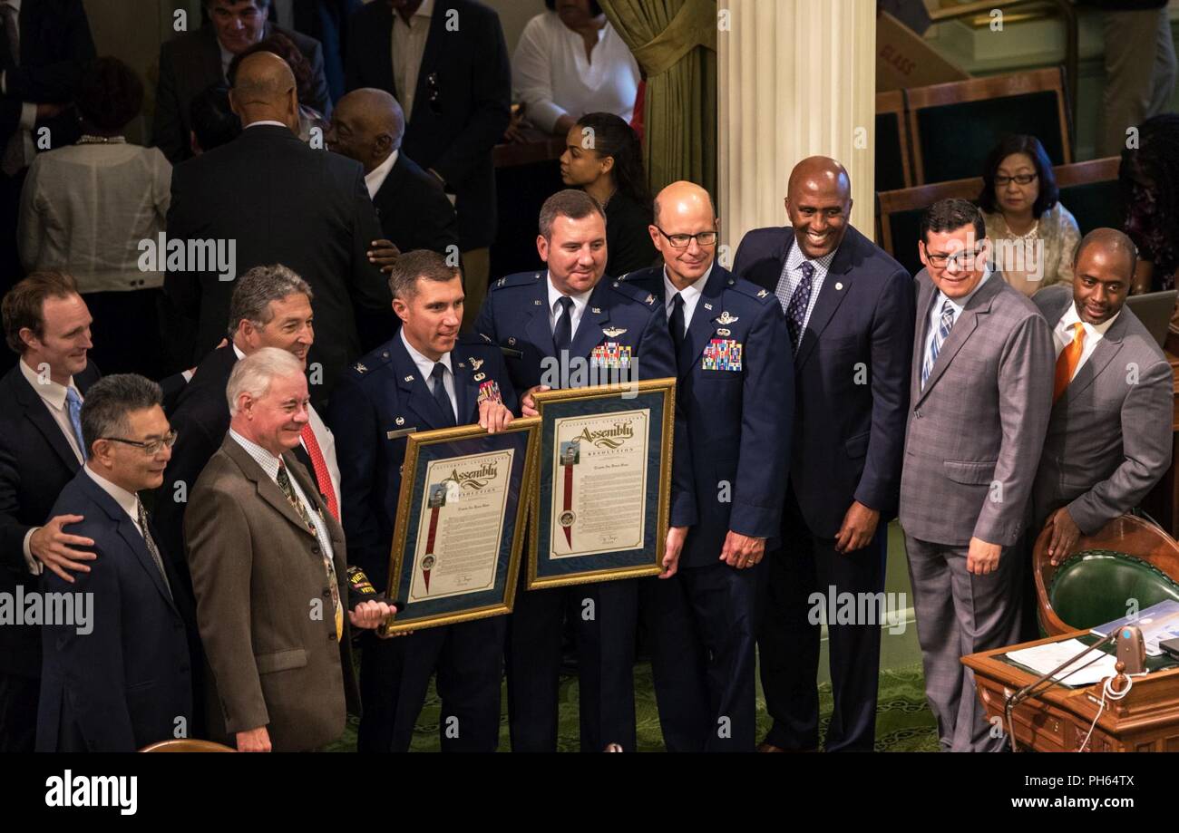 Assemblymember Jim Frazier presents Col. John Klein, 60th Air Mobility Wing commander, with a California State Assembly Resolution honoring the 75th Anniversary of Travis Air Force Base at the California State Capitol, Sacramento, June 25, 2018.  For the past 75 years, Travis AFB has been a focal point for the world as a power projection platform, a means to deliver hope, and a mission fueled by community support. Stock Photo