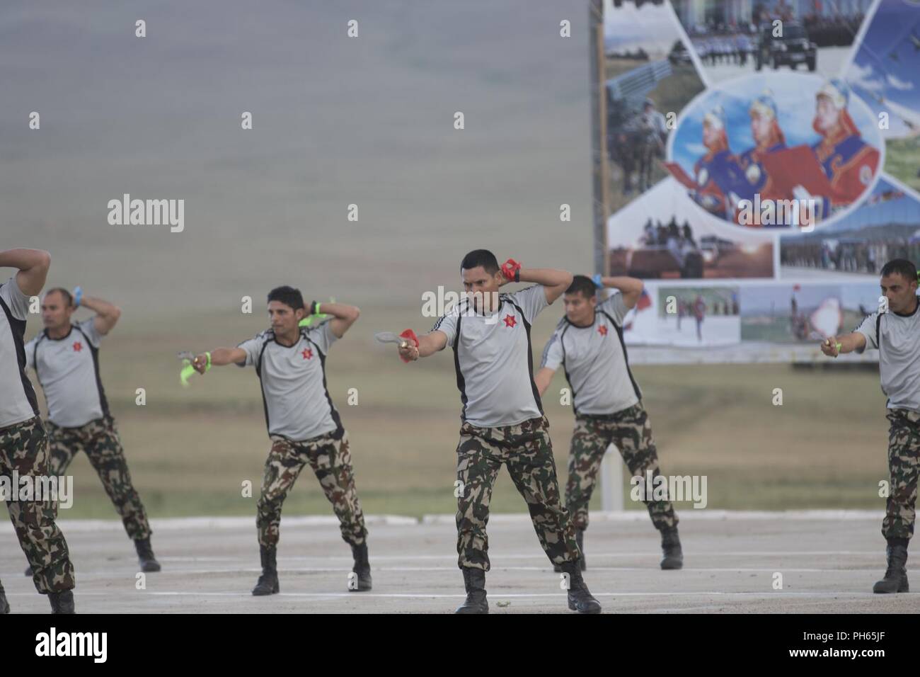 Nepal Army Soldiers perform a routine with their Kukri knife, June 24, 2018, during their Nepal Army Soldiers perform contemporary dance June 24, 2018, during their nation’s cultural event, which is a part of Khaan Quest 2018 at Five Hills Training Area, Mongolia. Khaan Quest is a combined (multinational) joint (multi-service) training exercise designed to strengthen the capabilities of U.S., Mongolian and other partner nations in international peace suppnation’s cultural event, which is a part of Khaan Quest 2018 at Five Hills Training Area, Mongolia. Khaan Quest is a combined (multinational) Stock Photo
