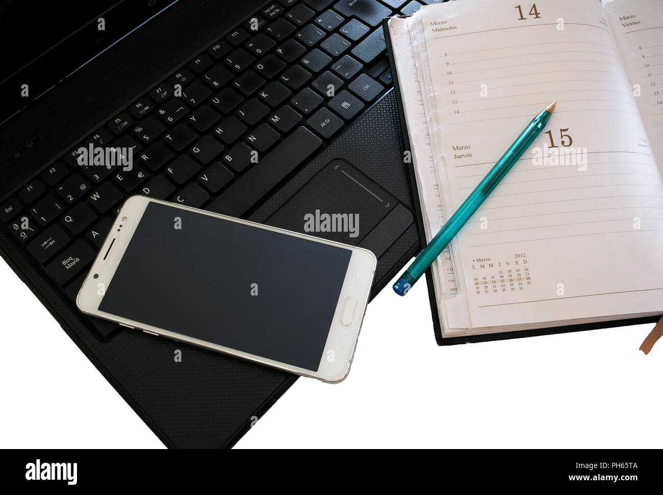 Laptop with smartphone and diary. Common objects in an office Stock Photo