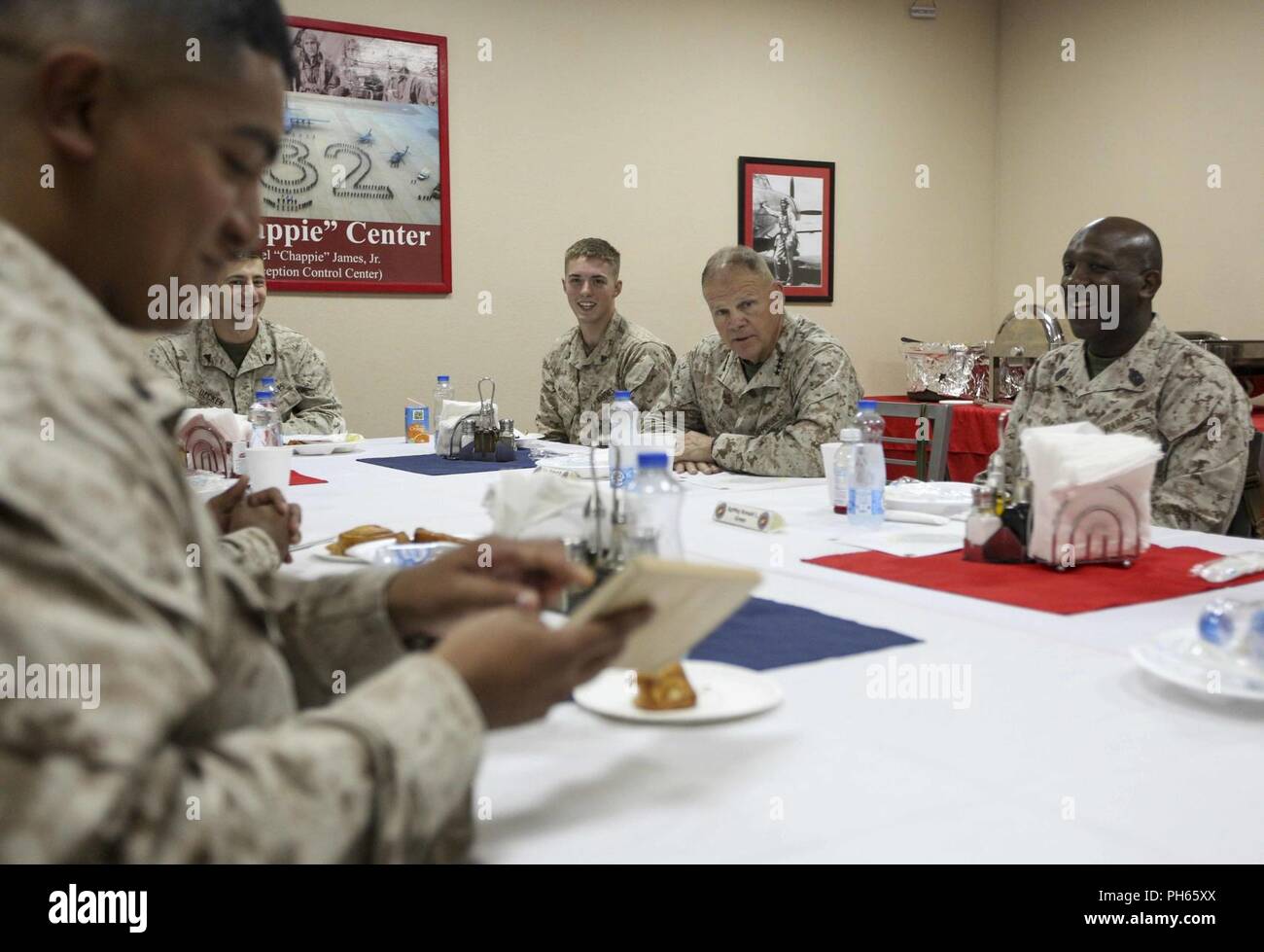 Commandant of the Marine Corps Gen. Robert B. Neller and Sgt. Maj. Ronald L. Green, sergeant major of the Marine Corps with Marines during breakfast in Al Jaber, Kuwait, June 26, 2018. Gen. Neller and Sgt. Maj. Green asked the Marines for ideas to improve the Marine Corps and answered questions. Stock Photo