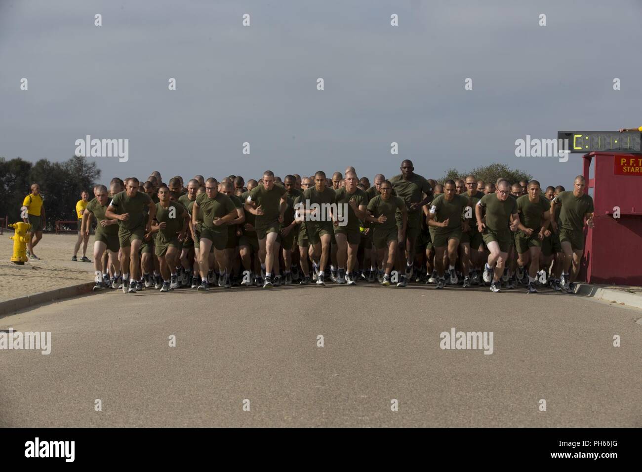 Recruits with Fox Company, 2nd Recruit Training Battalion, begin a three-mile run portion of a physical fitness test at Marine Corps Recruit Depot San Diego, June 25. In this final portion of the test recruits must run three miles. Annually, more than 17,000 males recruited from the Western Recruiting Region are trained at MCRD San Diego. Fox Company is scheduled to graduate Aug. 10. Stock Photo