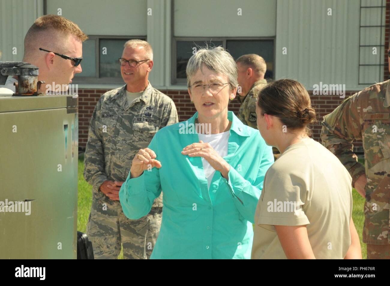 The Honorable Heather Wilson, Secretary of the Air Force, speaks to Airmen of the 114th Fighter Wing during a recent visit to Joe Foss Field, S.D., June 26. Unit members gave the Secretary a tour of their mobility line for an upcoming deployment. Stock Photo