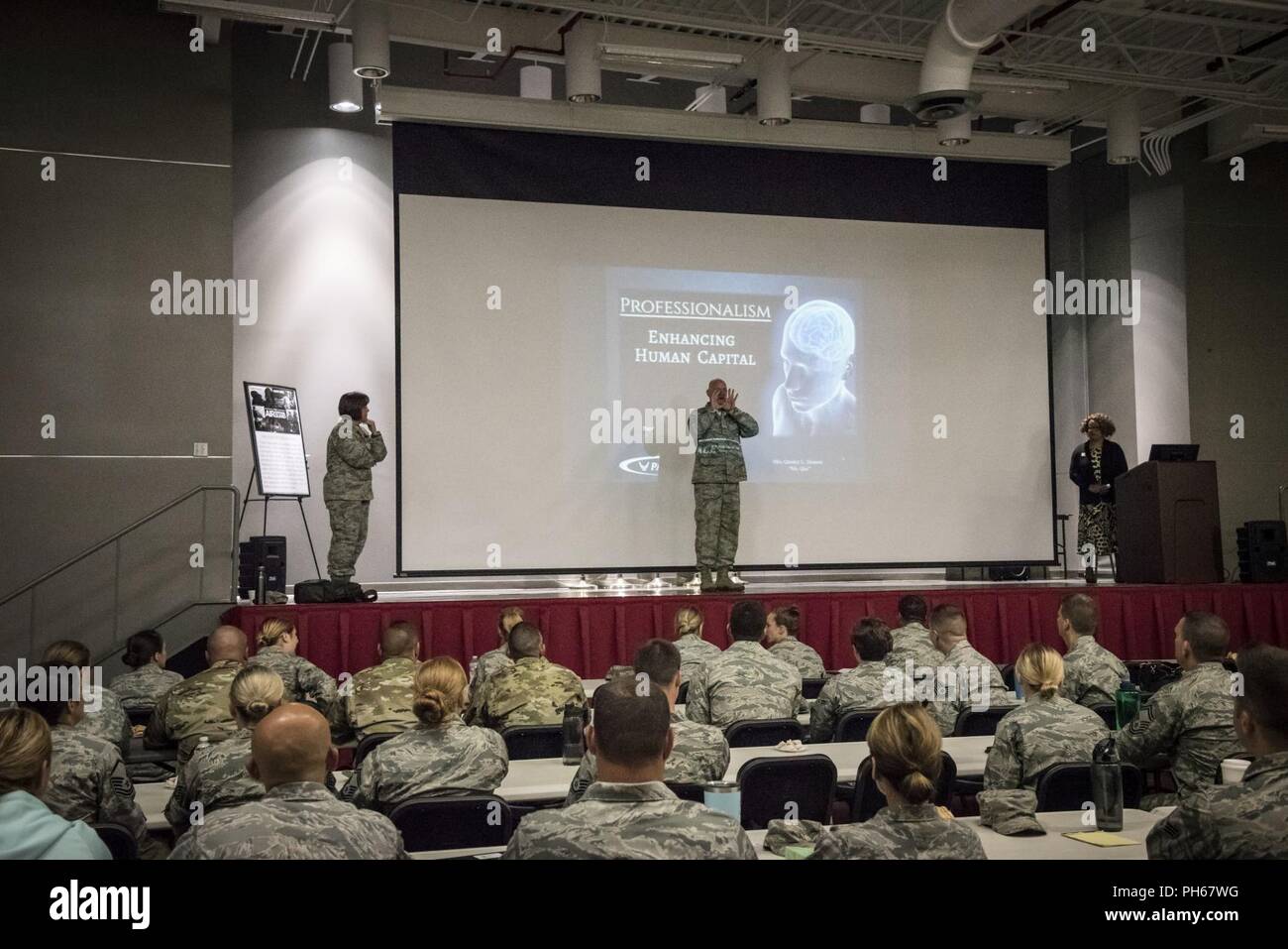 Command Chief Master Sgt. Mark Dyer addresses the audience before Mrs. Quency Henson, Civilian Professionalism Development, from the Profession of Arms Center of Excellence, leads a class focusing on human capital at the 200th RED HORSE Det. 1, Mansfield, Ohio, June 27, 2018. Approximately 100 Airmen and Soldiers attended the class to develop their leadership skills and learn how to better take care of their wingman or battle buddy to create a safer, more effective total force. Stock Photo