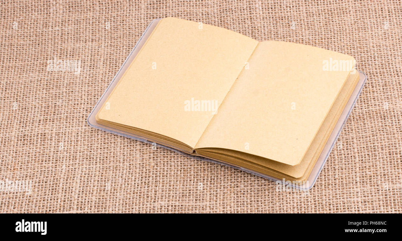 Pencil and notebook with a chain in the middle on spiral notebooks ...