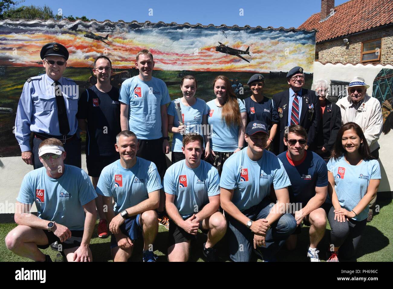 Participants of the Royal Air Force 100 Baton relay pose for a photo in