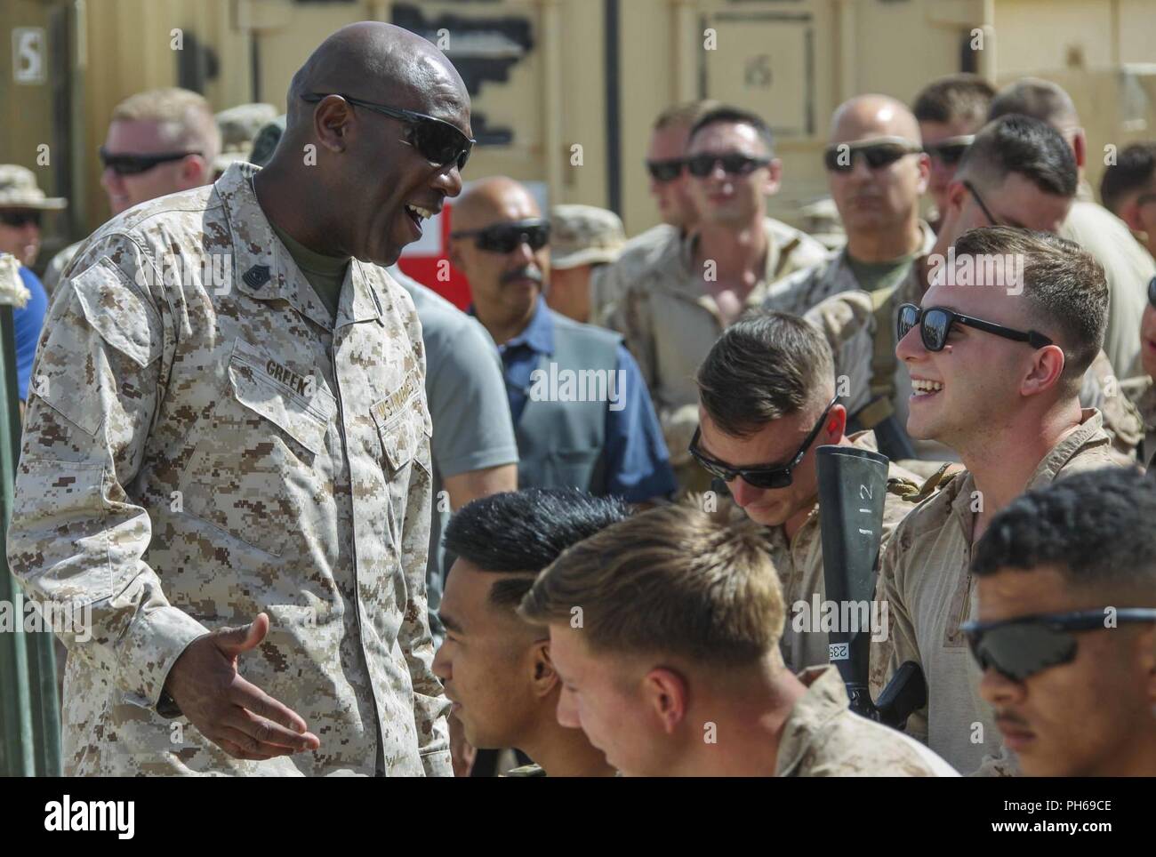 Sergeant Major of the Marine Corps Sgt. Maj. Ronald L. Green speaks with Marines before a town hall in Shorab, Afghanistan, June 28, 2018. Sgt. Maj. Green was there with Commandant of the Marine Corps Gen. Robert B. Neller to speak about the latest message to the force “Execute” and answer questions. Stock Photo