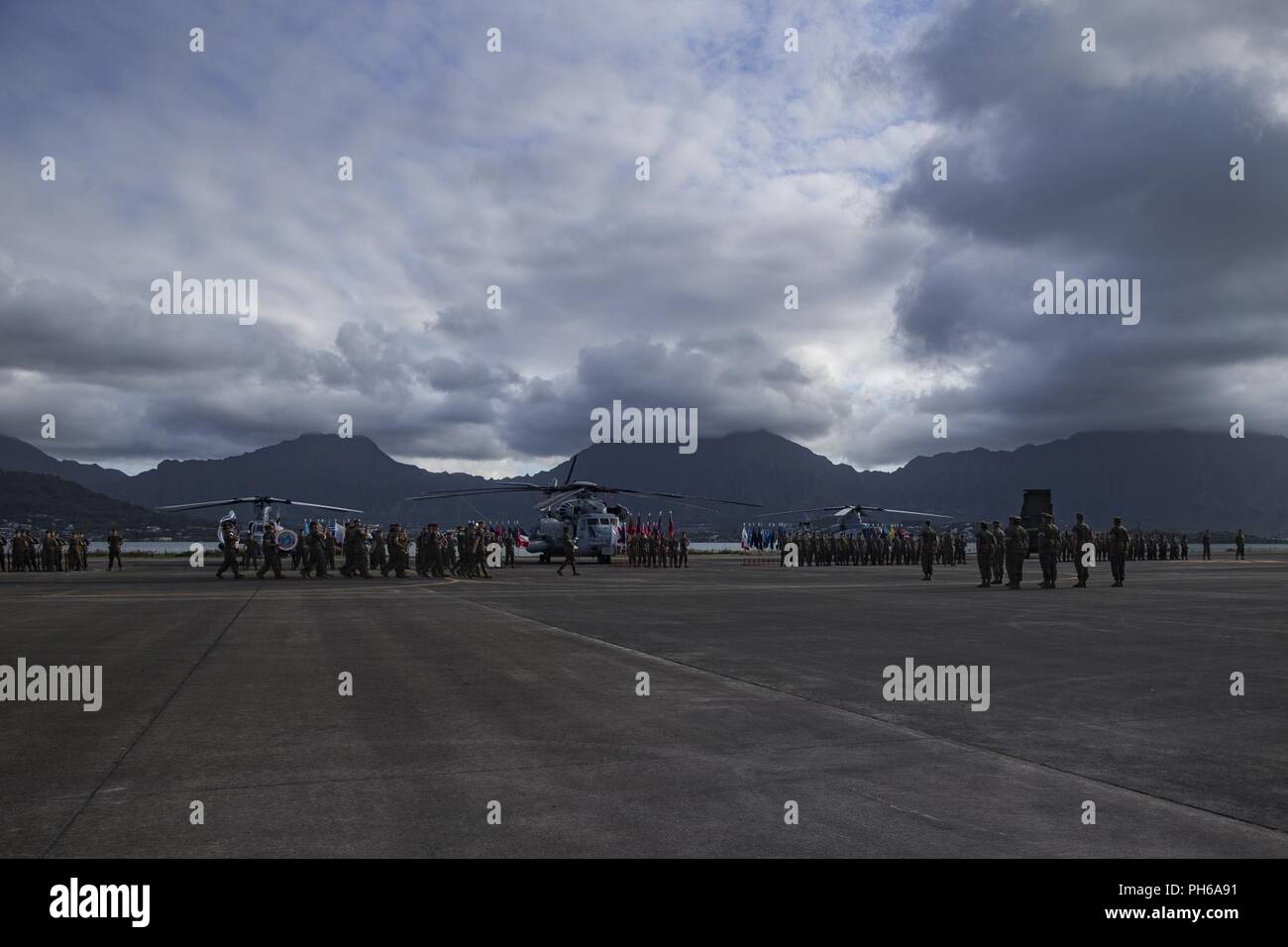 U.S. Marines with Marine Aircraft Group (MAG) 24, 1st Marine Aircraft Wing, stand in formation during the MAG 24 Change of Command Ceremony, Marine Corps Base Hawaii, June 29, 2018. Col. Christopher Patton relinquished command to Col. Stephen Lightfoot. Stock Photo