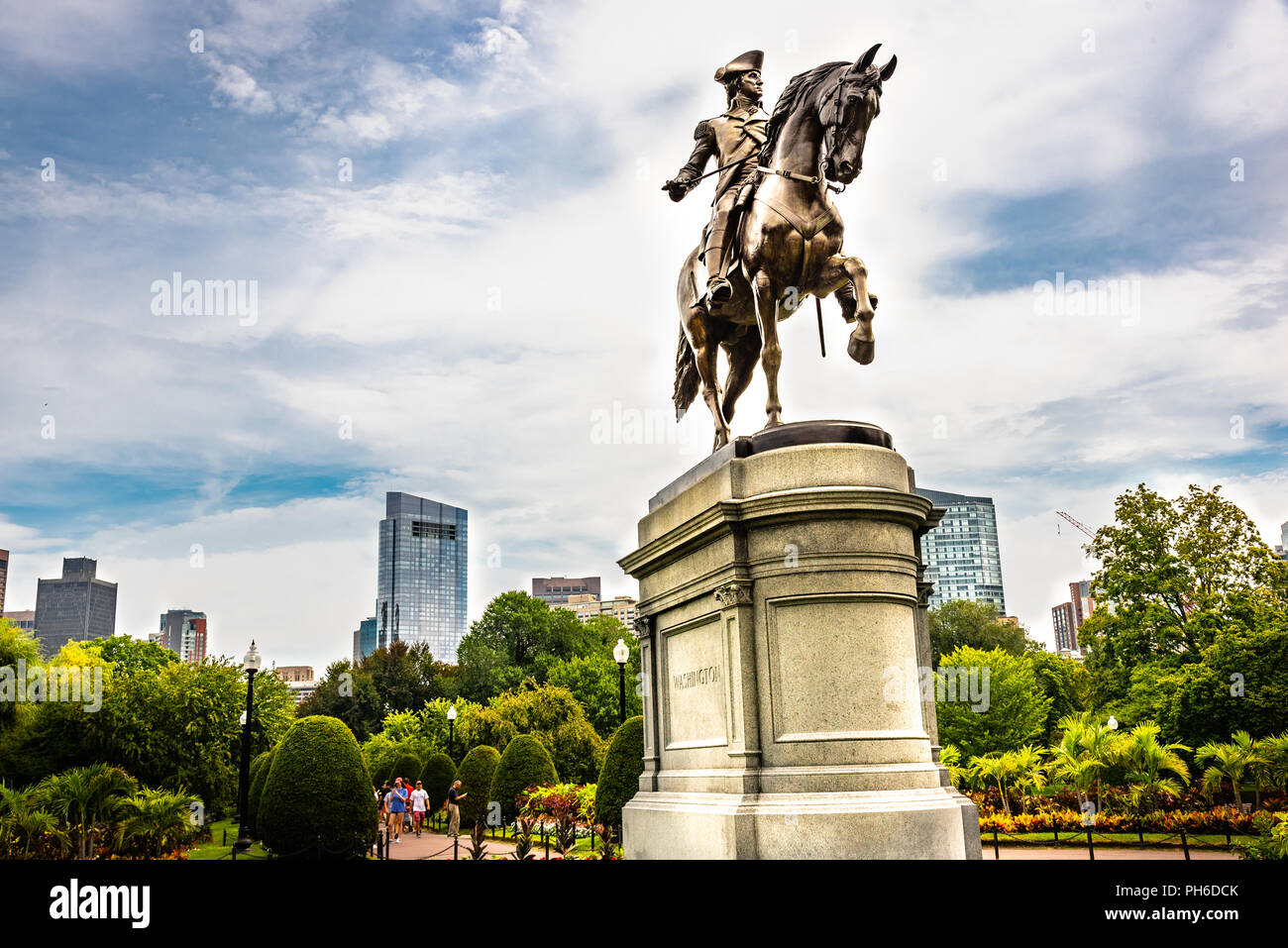 Washington statue in Boston Common Park with city skyline and