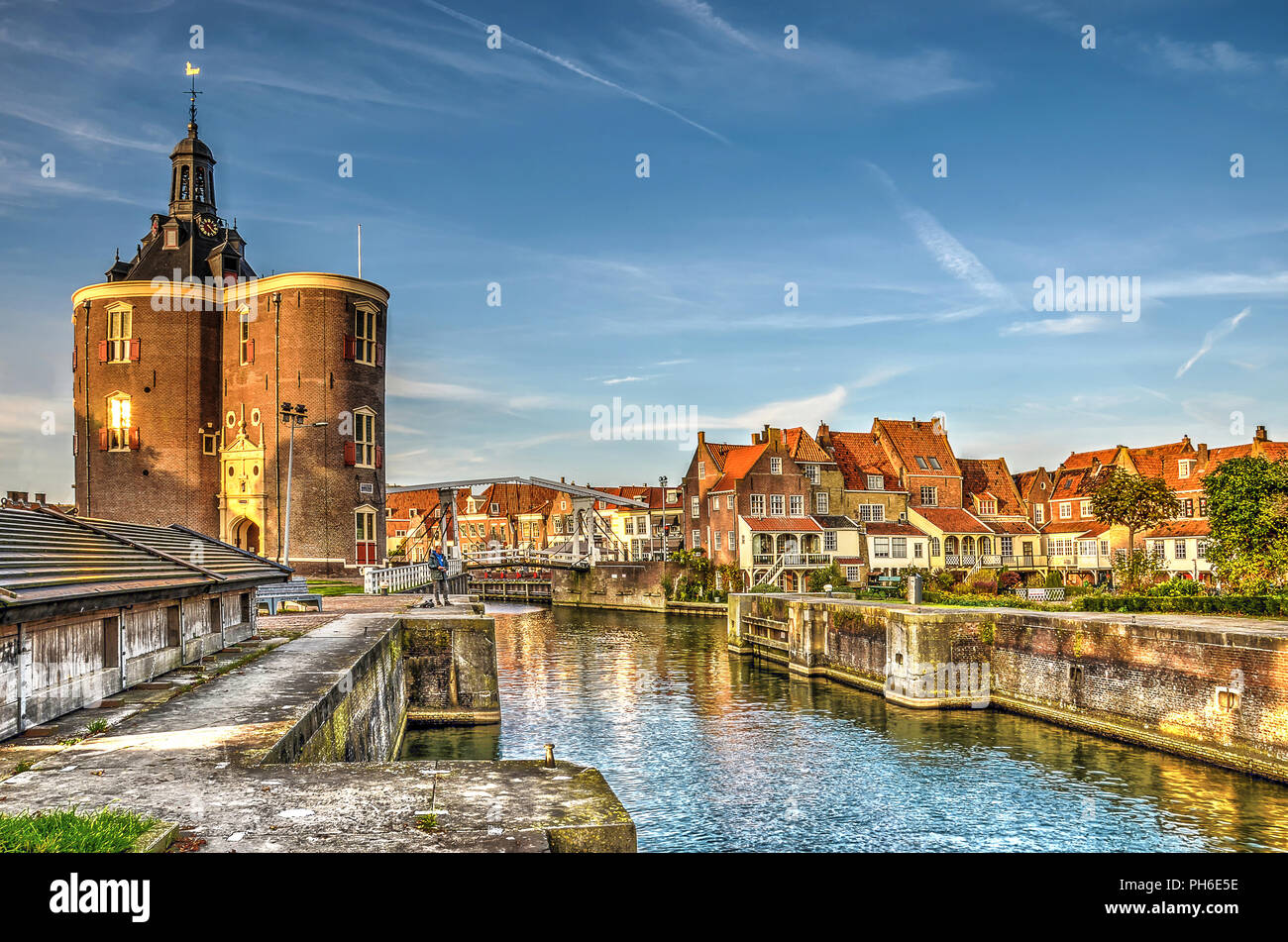 Enkhuizen, The Netherlands, October 26, 2015: View of the Old Harbour and Dromedaris Gate in the golden hour Stock Photo