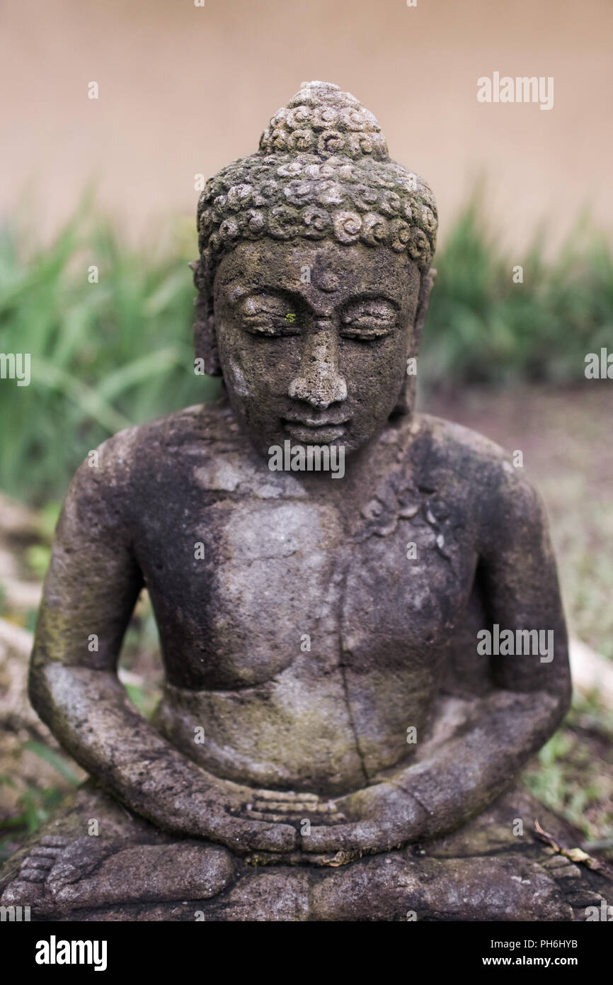 Old balinese deity statue Stock Photo - Alamy