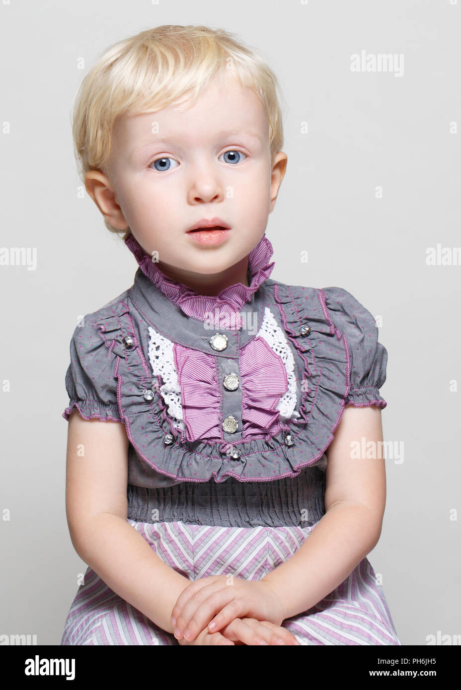 Closeup Portrait Of Cute Child Toddler Girl With Blonde Hair And