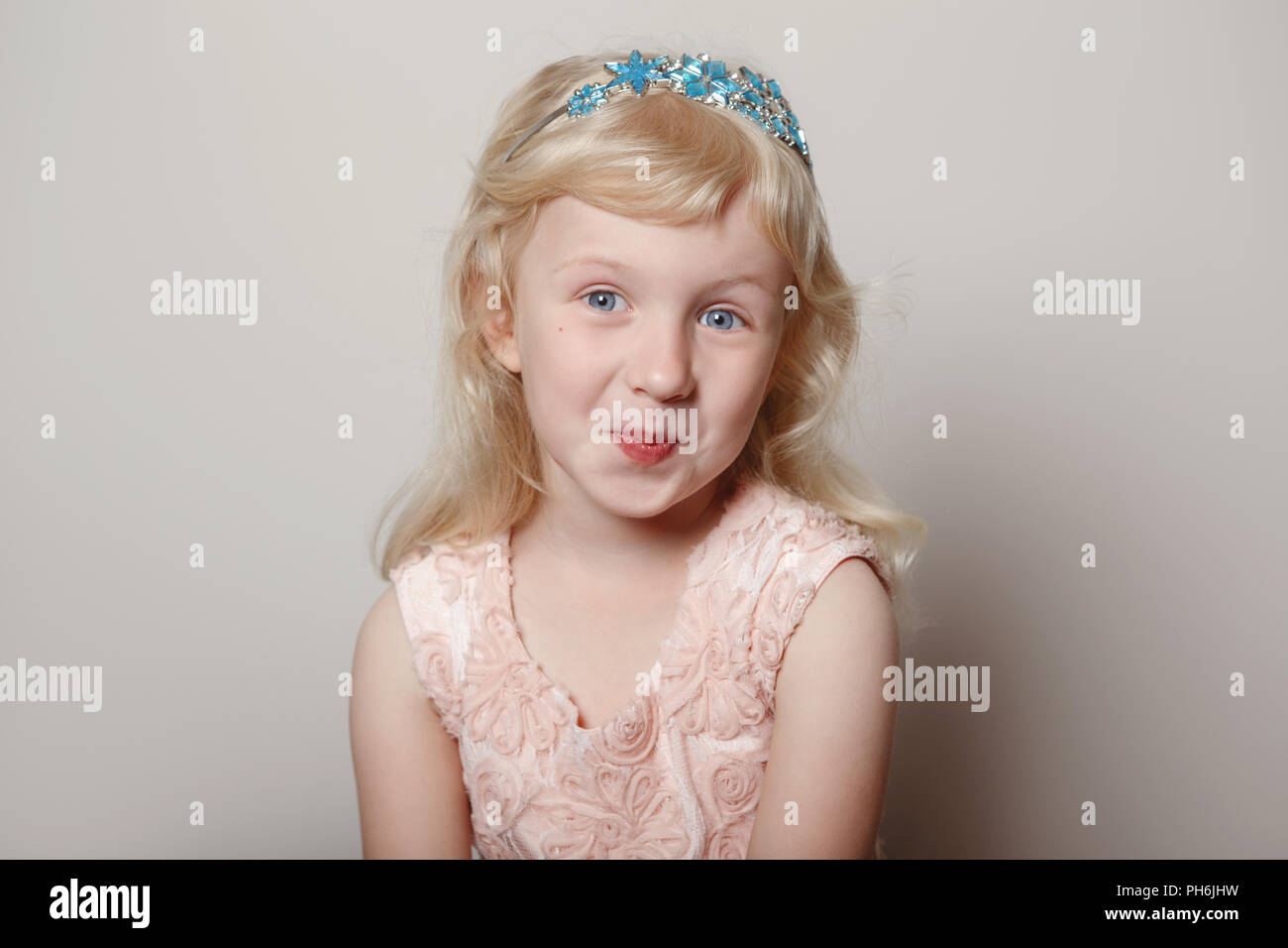 Surprised child in crown hi-res stock photography and images - Alamy