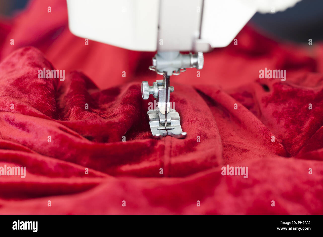 Sewing machine with textiles Stock Photo