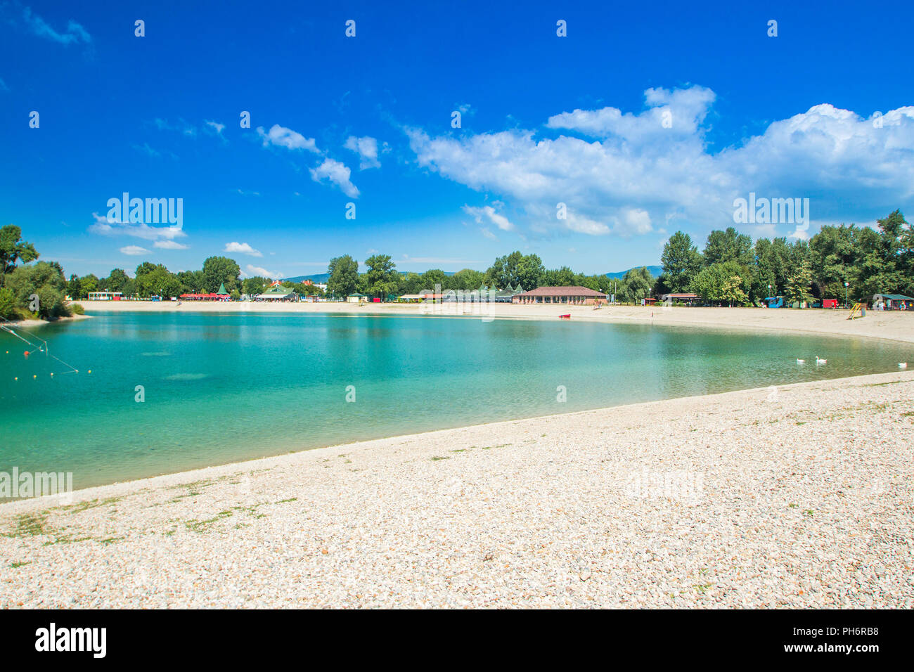 Beautiful Jarun lake in Zagreb, Croatia, sand shore, sunny summer day Stock Photo