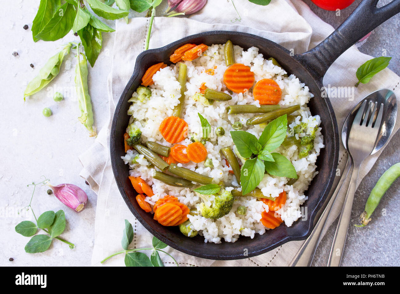 Healthy food Fried rice with vegetables. Prepared and served in a castiron frying pan. Diet