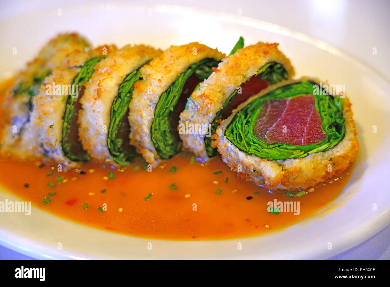 Deep fried panko crusted tuna and spinach sushi roll Stock Photo Alamy
