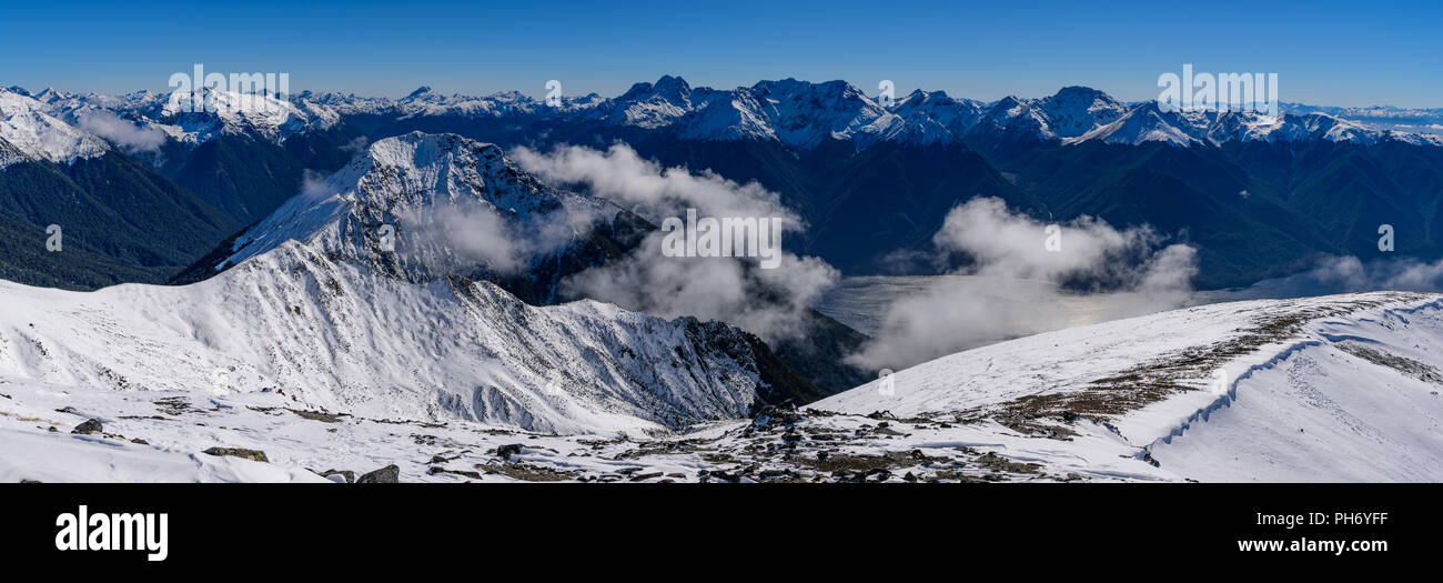 Walking at Kepler Track in Fiordland National Park in winter with snow mountains, South Island, New Zealand Stock Photo