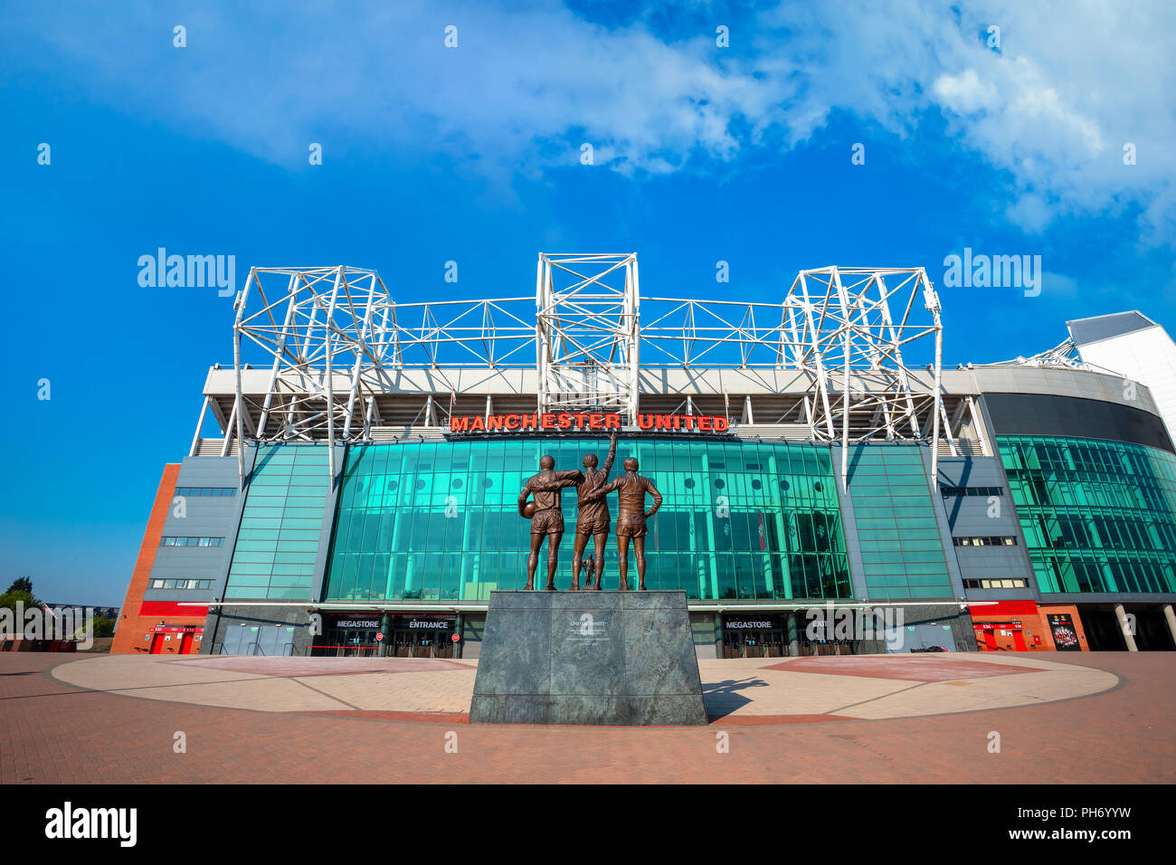 MANCHESTER, UK - MAY 19 2018: The United Trinity bronze sculpture which composed with George Best, Denis Law and Sir Bobby Charlton in front of Old Tr Stock Photo