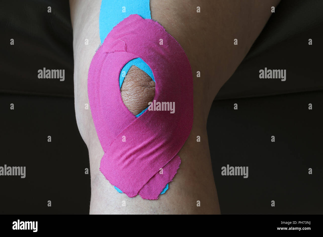 Medical Tape on one knee Stock Photo Alamy