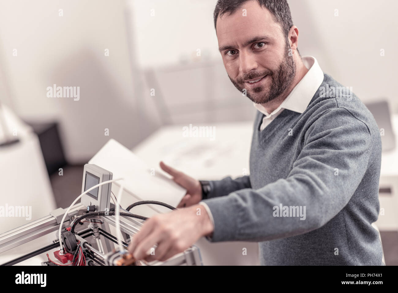 Serious technician using digital hi-res stock photography and images ...