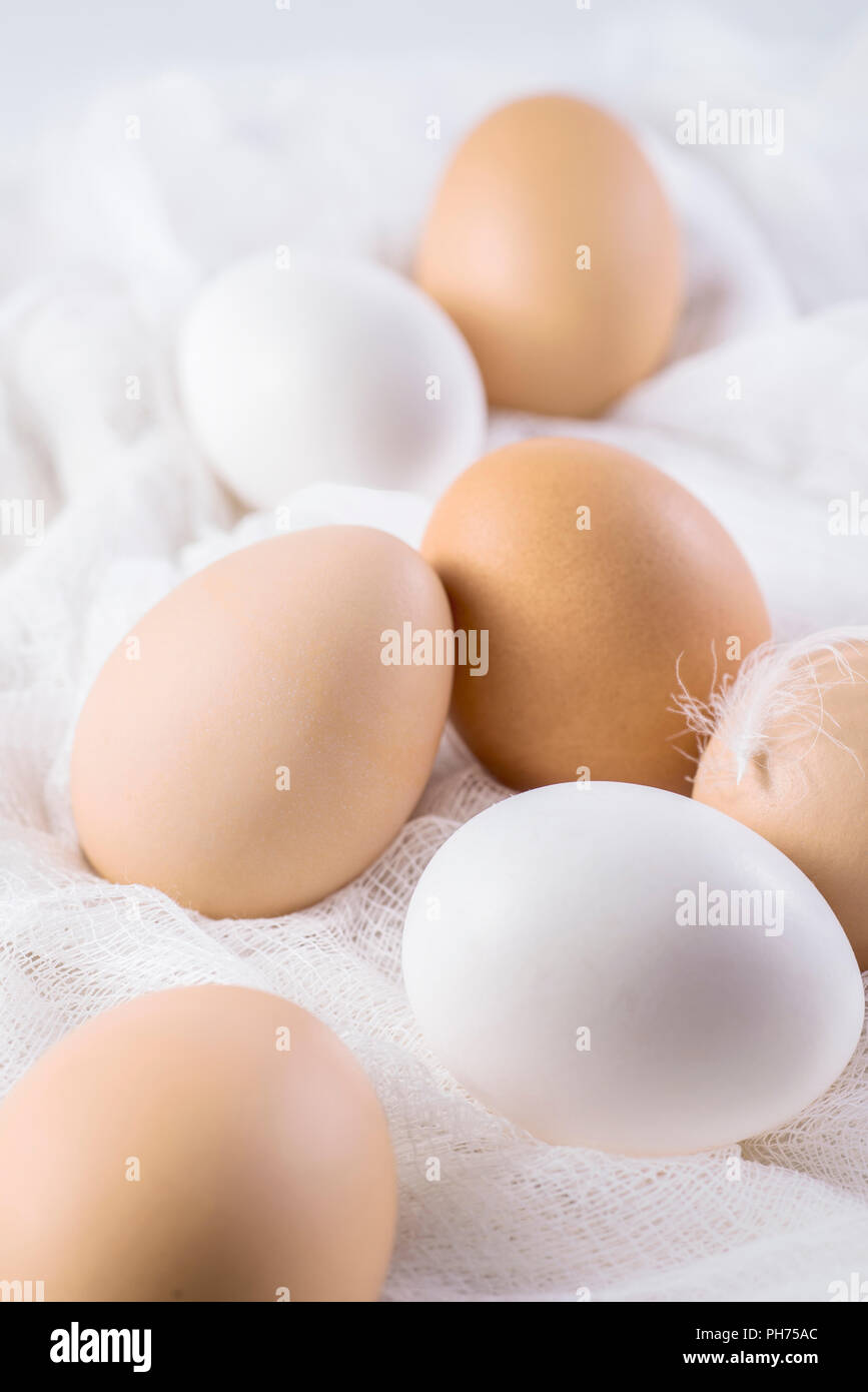 Several brown and white eggs on cloth country style Stock Photo