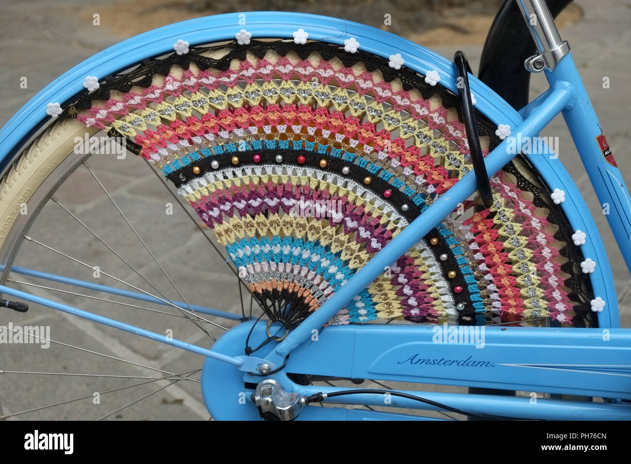 Bicycle with a crocheted clothes guard on the backwheel Stock Photo