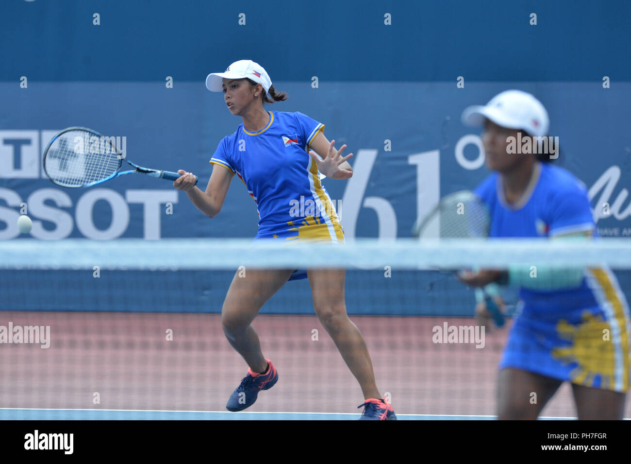 180831) -- PALEMBANG, Aug. 31, 2018 (Xinhua) -- Odessa Mariel Arzaga (L)  and Princess Lorben Catindig of Philippines compete during soft tennis  women's team preliminary Group B between China and the Philippines