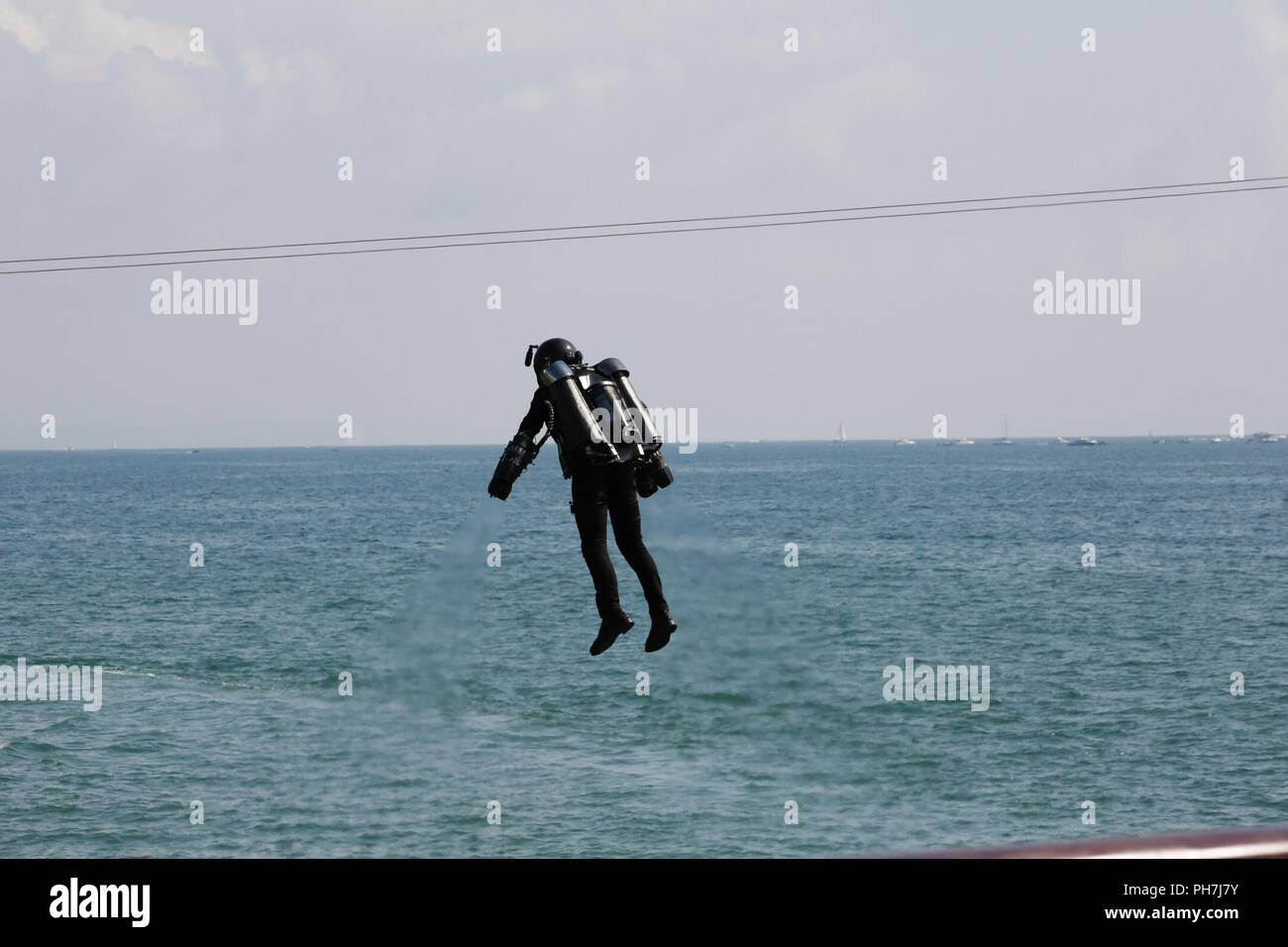 Bournemouth, UK. 31st Aug 2018. Crowds flock to Bournemouth for the 2nd day of the Bournemouth Air Festival. The Gravity Jet Suit Display Team thrill the crowds with their demonstration. Displaying for the first time at a public event with two jet suit pilots, showcasing the next frontier in human flight! The jet pack pilots have gas turbines strapped onto them - 5 turbine engines, two on each arm and a larger engine on their back. Credit: Carolyn Jenkins/Alamy Live News Stock Photo