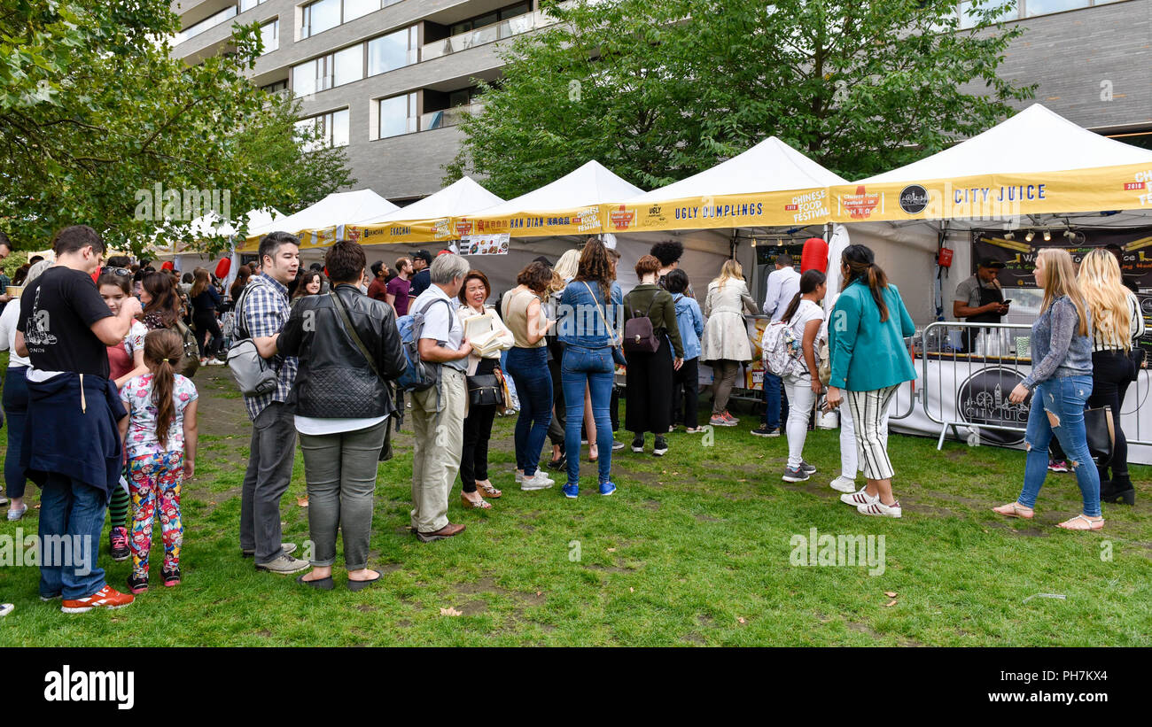 London, UK.  31 August 2018. Visitors attend the opening day of the three day Chinese Food Festival at Potters Fields Park next to City Hall.  As well as food and drink from different parts of China freshly prepared for visitors to try, there are cooking demonstrations and presentations by the UK Han Culture Association.  Credit: Stephen Chung / Alamy Live News Stock Photo