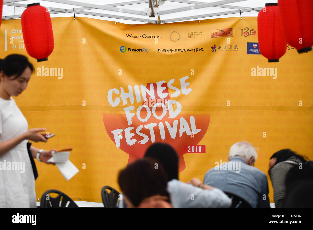 London, UK.  31 August 2018.  Visitors attend the opening day of the three day Chinese Food Festival at Potters Fields Park next to City Hall.  As well as food and drink from different parts of China freshly prepared for visitors to try, there are cooking demonstrations and presentations by the UK Han Culture Association.  Credit: Stephen Chung / Alamy Live News Stock Photo