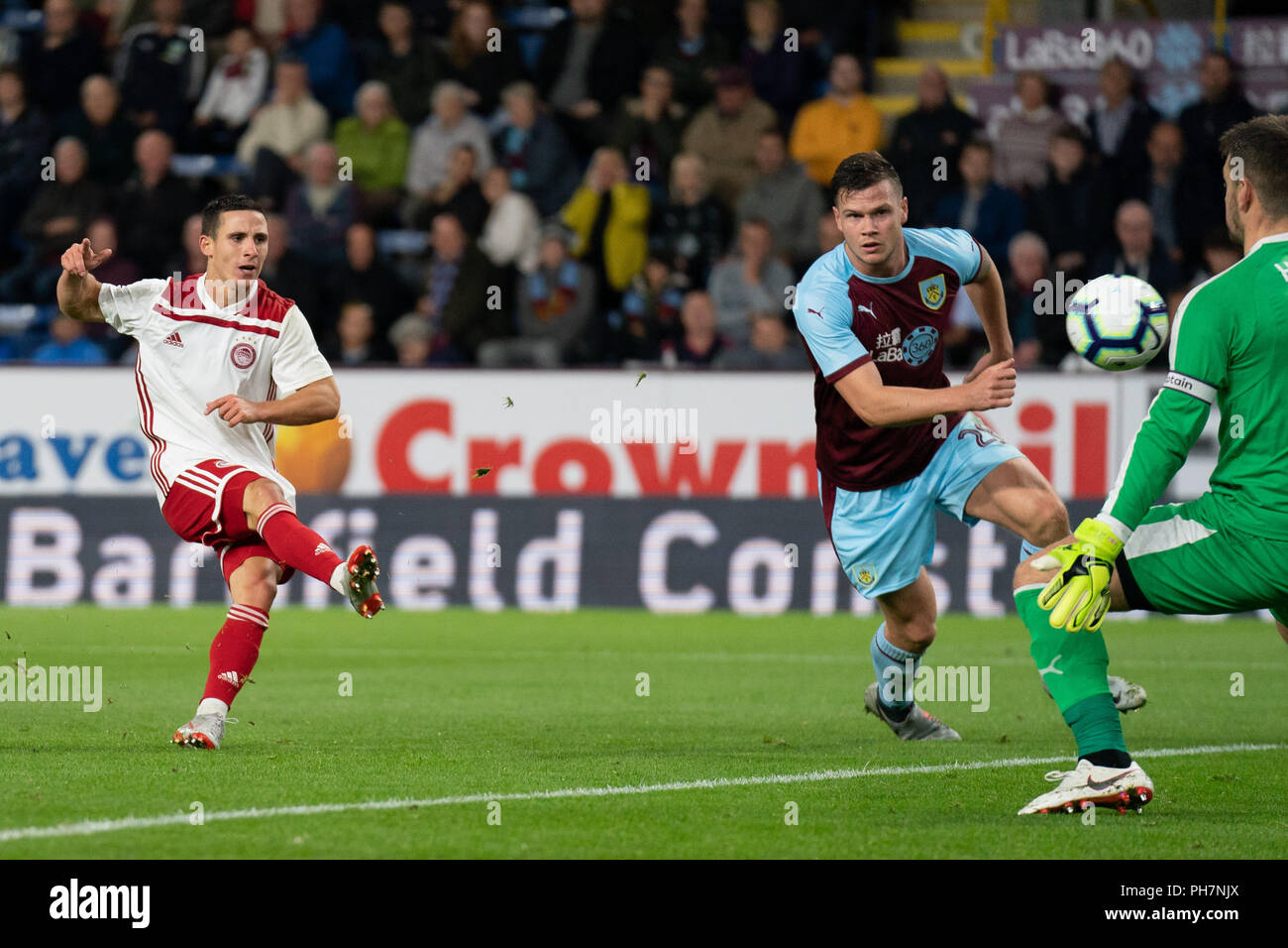 Burnley, UK. 30th August 2018. Olympiacos's Daniel Podence scores his sides first goal    30th August 2018, Turf Moor, Burnley, England; UEFA Europa League, Play off leg 2 of 2, Burnley v Olympiacos FC Credit: Terry Donnelly/Alamy Live News Stock Photo