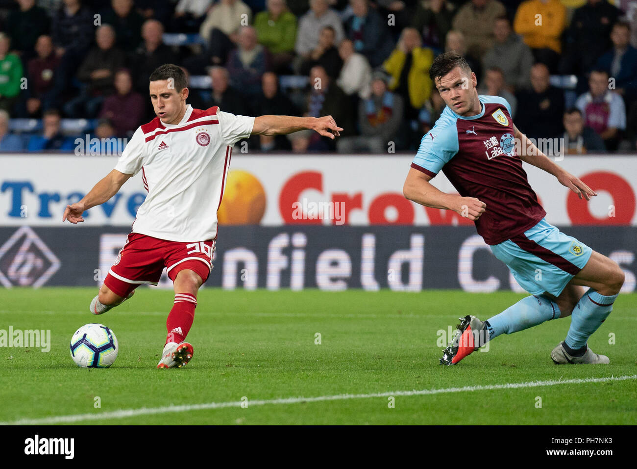 Burnley, UK. 30th August 2018. Olympiacos's Daniel Podence scores his sides  first goal 30th August 2018, Turf Moor, Burnley, England; UEFA Europa  League, Play off leg 2 of 2, Burnley v Olympiacos
