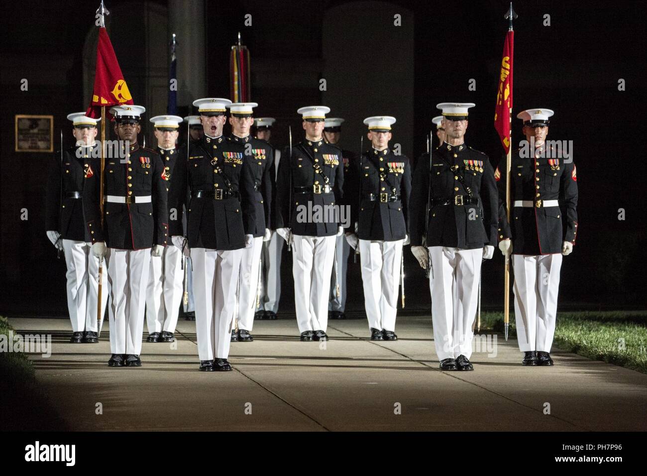 Marines with Marine Barracks Washington D.C. march down Center Walk during a Friday Evening Parade at the Barracks, June 29, 2018. The guest of honor for the ceremony was the Under Secretary of the Navy, Thomas B. Modly, and the hosting official was the Assistant Commandant of the Marine Corps, Gen. Glenn M. Walters. Stock Photo
