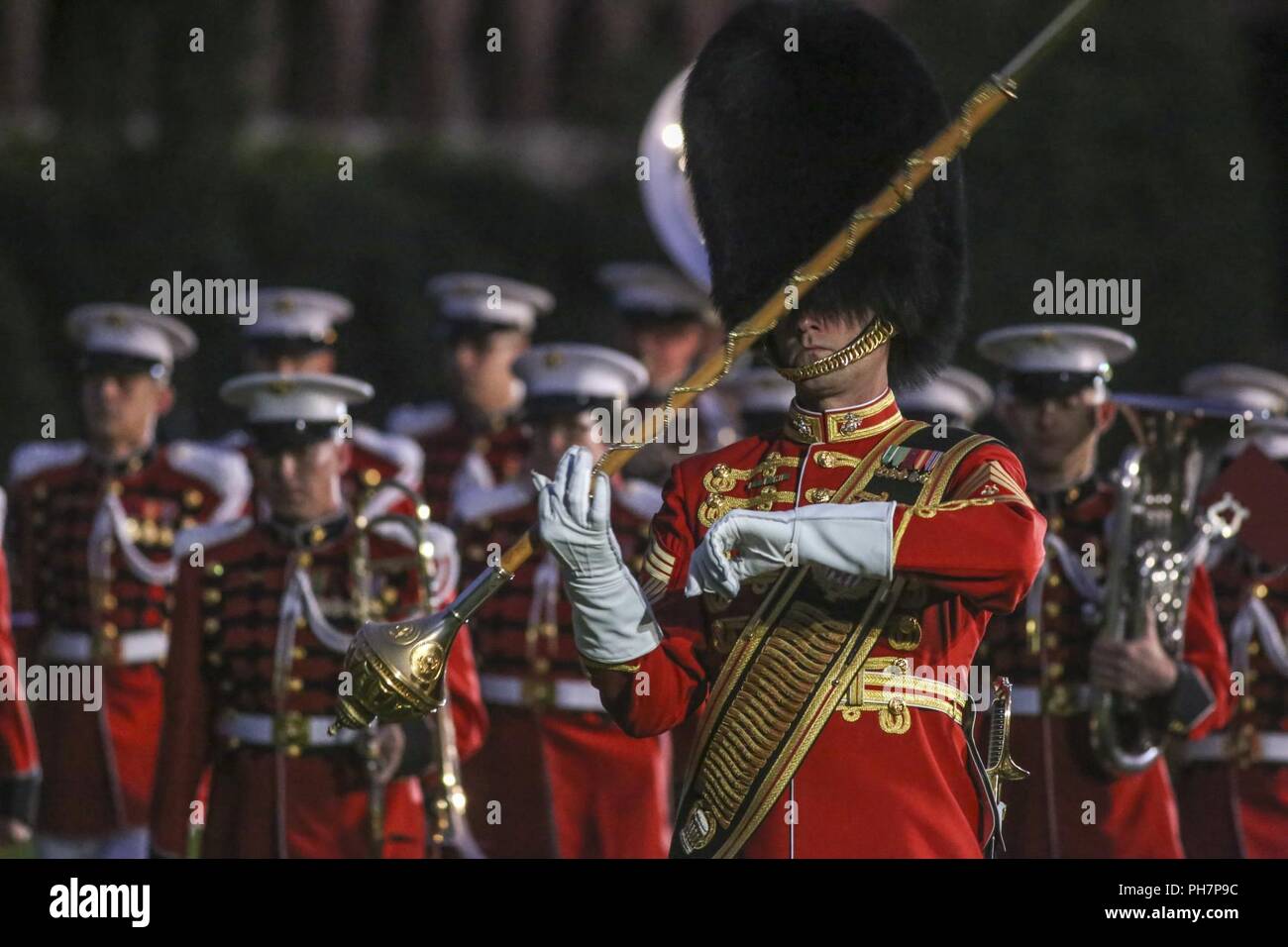 Marines with "The Presidents Own" United States Marine Band march to their positions during a Friday Evening Parade at Marine Barracks Washington D.C., June 29, 2018. The guest of honor for the ceremony was the Under Secretary of the Navy, Thomas B. Modly, and the hosting official was the Assistant Commandant of the Marine Corps, Gen. Glenn M. Walters. Stock Photo