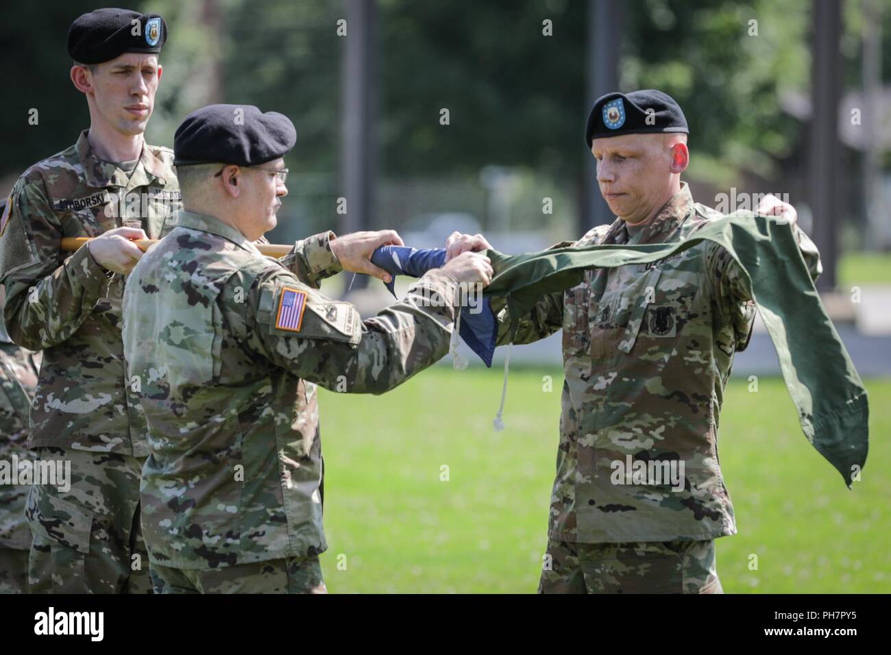 Chief Warrant Officer 4 James Bettencourt and 1st. Sgt. Daniel Shannon with 389th U.S. Army Materiel Command Band case the colors during an inactivation ceremony, at Redstone Arsenal, June 29, 2018. Since relocating to Redstone Arsenal from Aberdeen Proving Ground, Maryland, in 2011, the AMC band has performed more than 2,700 times, at more than 60 locations around the world in support of the AMC enterprise, the Redstone Arsenal Garrison, and military and civilian functions. Stock Photo