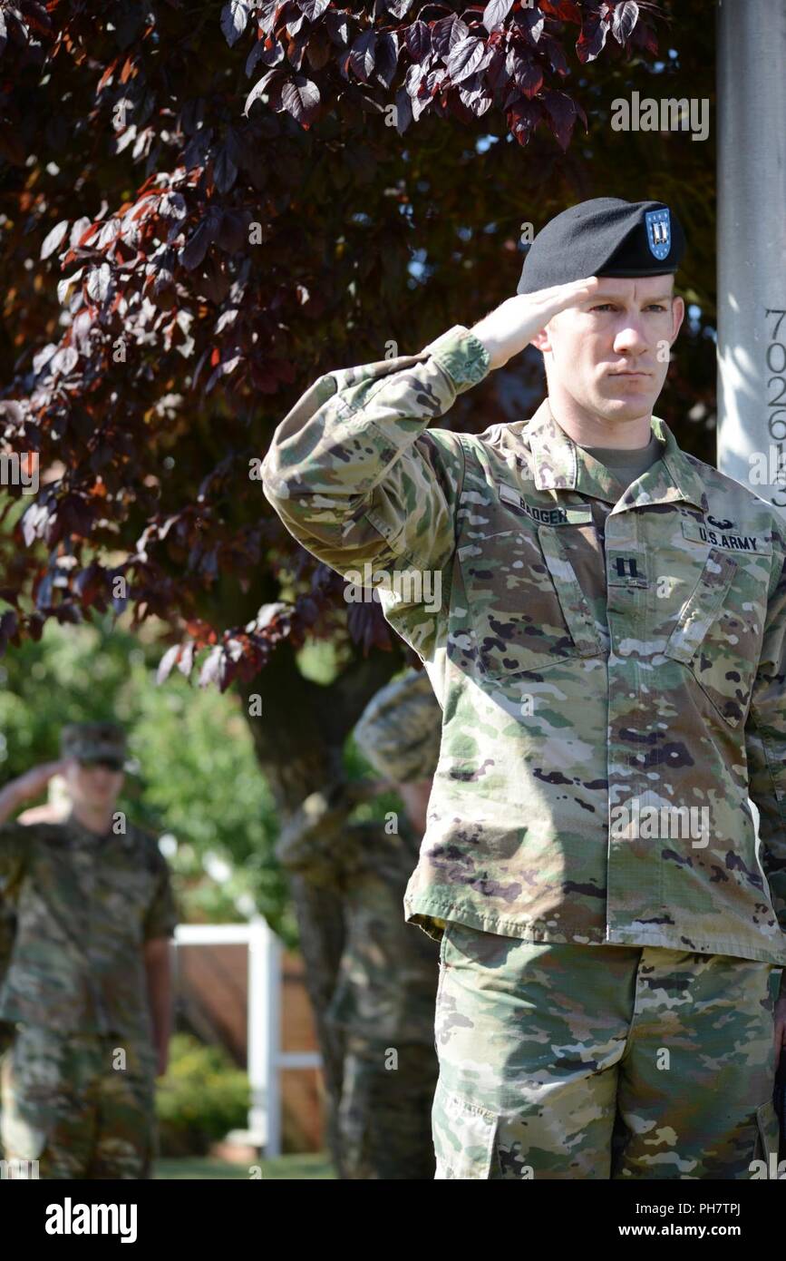U.S. Army Cpt. Andrew Badger, assigned to 2nd Signal Brigade, stand at