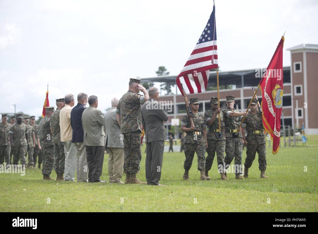 U.S. Marines and Color Guard assigned to 2nd Marine Expeditionary Force conducts the pass and review during Maj. Gen. Niel E. Nelson's retirement ceremony at Camp Lejeune, N.C., June 26, 2018. The ceremony was held in honor of Maj. Gen. Nelson's 35 years of faithful and honorable service. Stock Photo