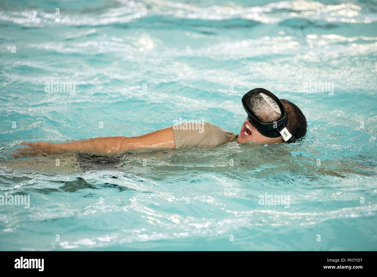 Air Force Special Operations Recruiter Tech Sgt. Maria Pineda swims during a 350th Battlefield Airman Training Squadron preparatory course at Joint Base San Antonio-Lackland in San Antonio, Texas June 28, 2018. Pineda experienced many of the same challenges presented to her recruits by the squadron. Stock Photo