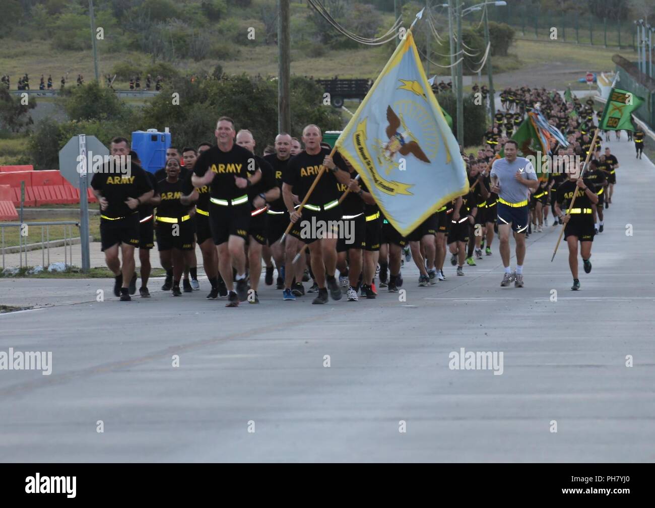 Joint Task Force Guantanamo Deputy Commander, Air Force Brig. Gen. Charles Stevenson, and Joint Detention Group Commander, Army Col. Stephen E. Gabavics, lead a formation of JDG Soldiers during the annual JDG 2.5-mile Fun Run at Naval Station Guantanamo Bay, June 26 as part of Gabavics’ final day in command. (Army Reserve Stock Photo