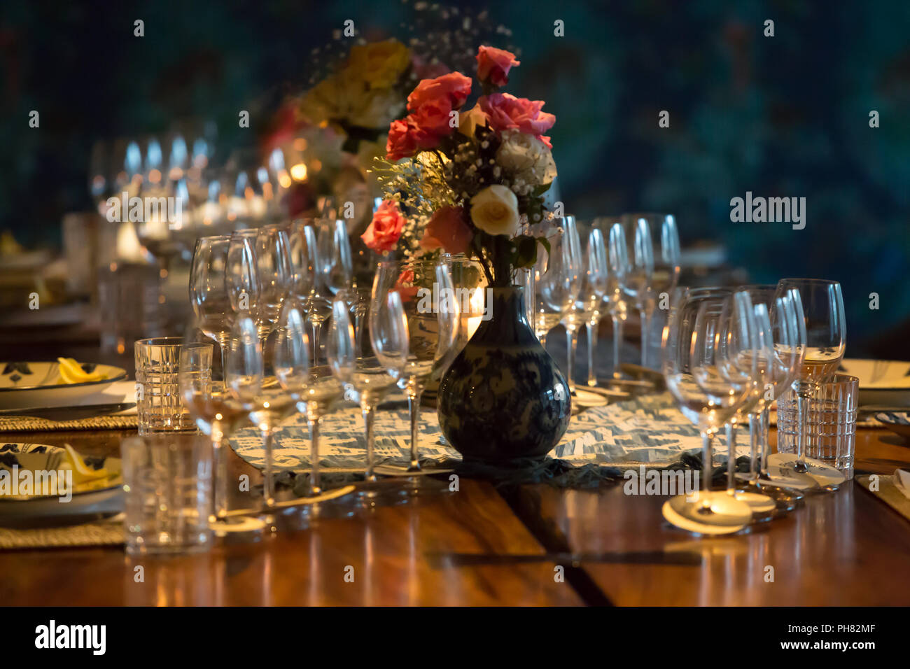 Glasses for champagne, wine, stand on a table. Wedding party, dinner or special event set up. Stock Photo